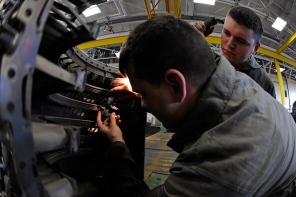 ELLSWORTH AIR FORCE BASE, S.D. – (Right) Airmen 1st Class Steven Durr and Jesse Davis, 28th Maintenance Squadron aerospace propulsion technicians, inspect honey comb seals on the front compressor of a B-1B Lancer engine, March 25.  The 28 MXS services 29 B-1s from both bomb squadrons. (U.S. Air Force photo/Senior Airman Marc I. Lane)