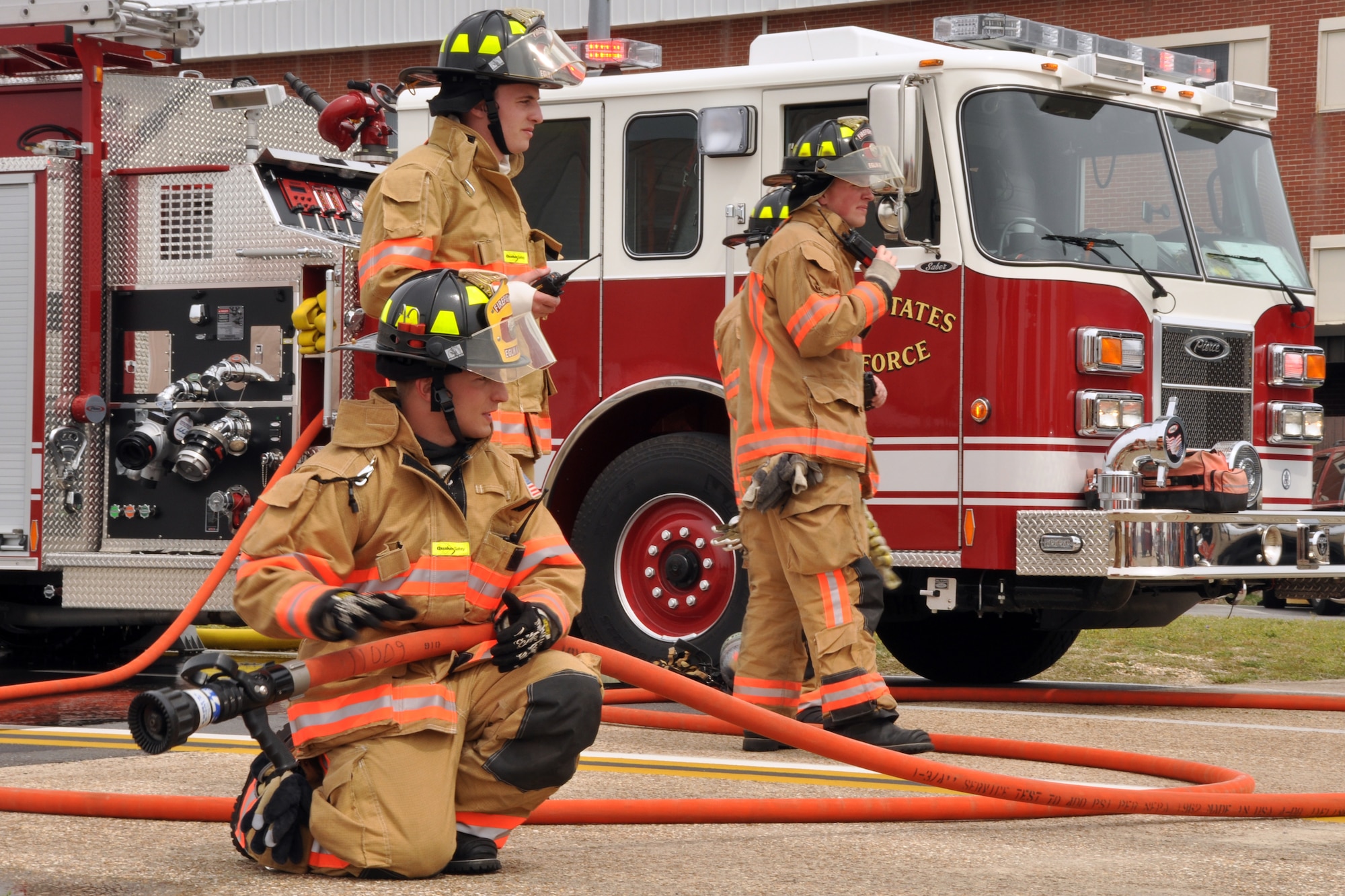 EGLIN AIR FORCE BASE, Fla. –  96th Civil Engineer Group firefighters prepare to advance on a simulated crashed aircraft during a Major Accident Response Exercise here, March 24. The event simulated an aircraft crash to test how quickly Eglin’s first responders could react to a catastrophe and effectively treat victims. (U.S. Air Force photo/ Airman 1st Class Anthony Jennings)
