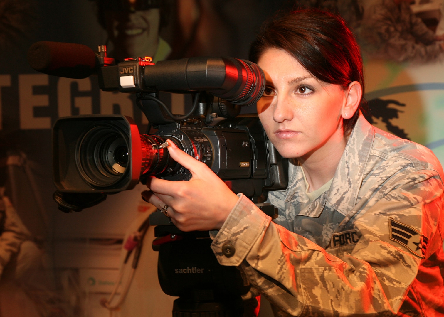 Senior Airman Holly Roberts, 3rd Combat Camera Squadron, frames a shot during a video shoot. (U.S. Air Force photo/Robbin Cresswell)