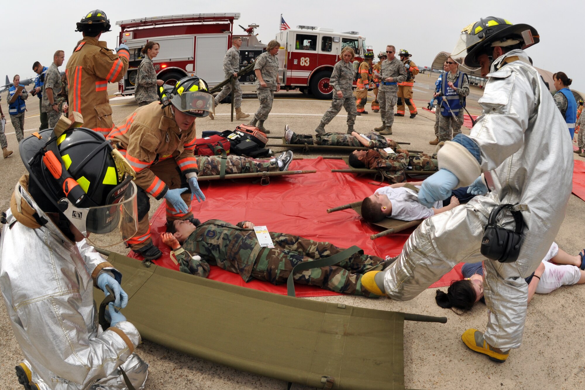 EGLIN AIR FORCE BASE, Fla. – 96th Medical Group personnel and 96th Civil Engineer Group firefighters triage and treat simulated victims during a Major Accident Response Exercise here, March 24. Twenty-four volunteers wore moulage to simulate real injuries and enable medical personnel to better train for real-world scenarios. The event simulated an aircraft crash to test how quickly Eglin’s first responders could react to a catastrophe and effectively treat victims. (U.S. Air Force photo/ Airman 1st Class Anthony Jennings)