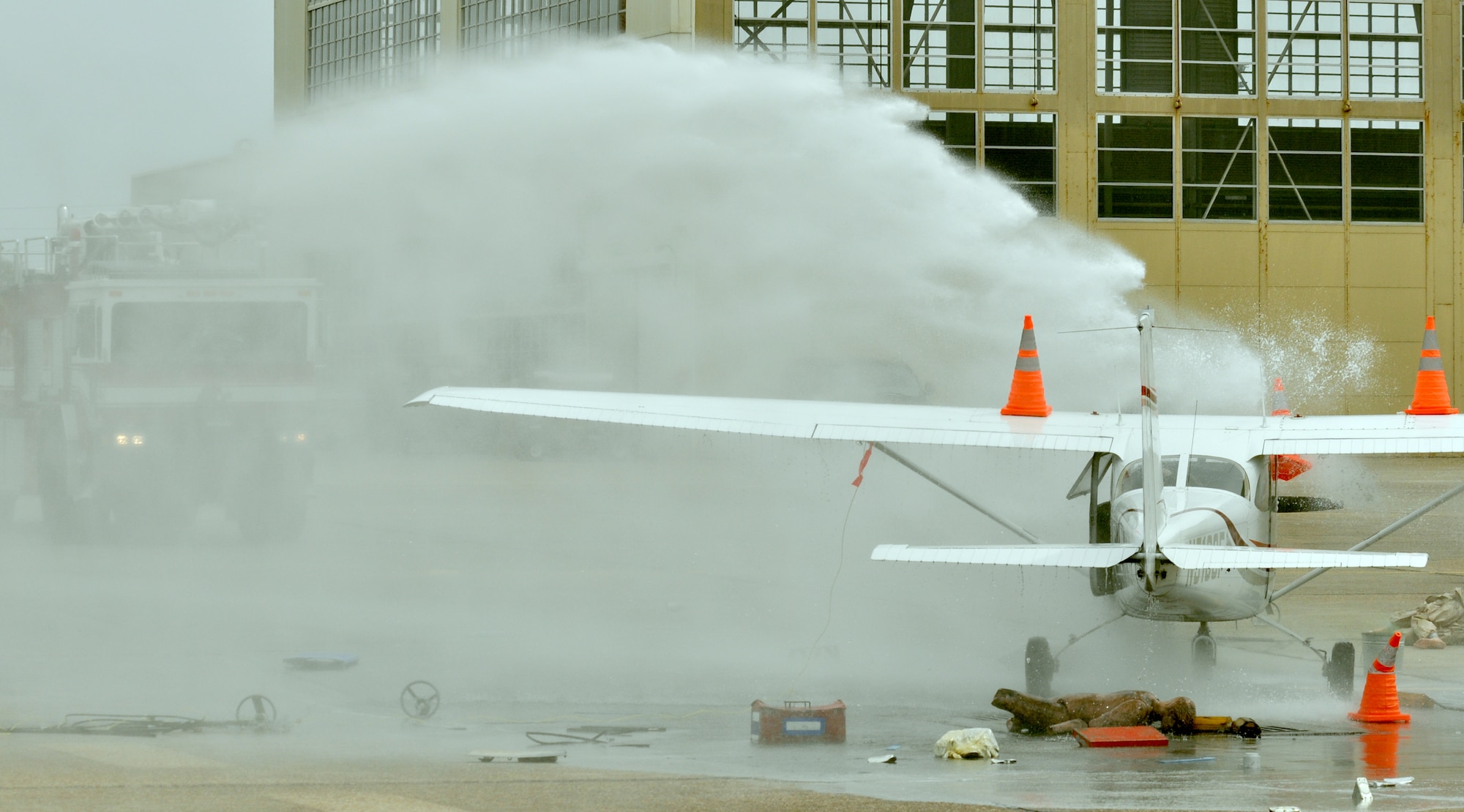 EGLIN AIR FORCE BASE, Fla. --  96th Civil Engineer Group firefighters extinguish a simulated fire from a crashed aircraft during a Major Accident Response Exercise here, March 24. The event simulated an aircraft crash to test how quickly Eglin’s first responders could react to a catastrophe and effectively treat victims. (U.S. Air Force photo/ Airman 1st Class Anthony Jennings)