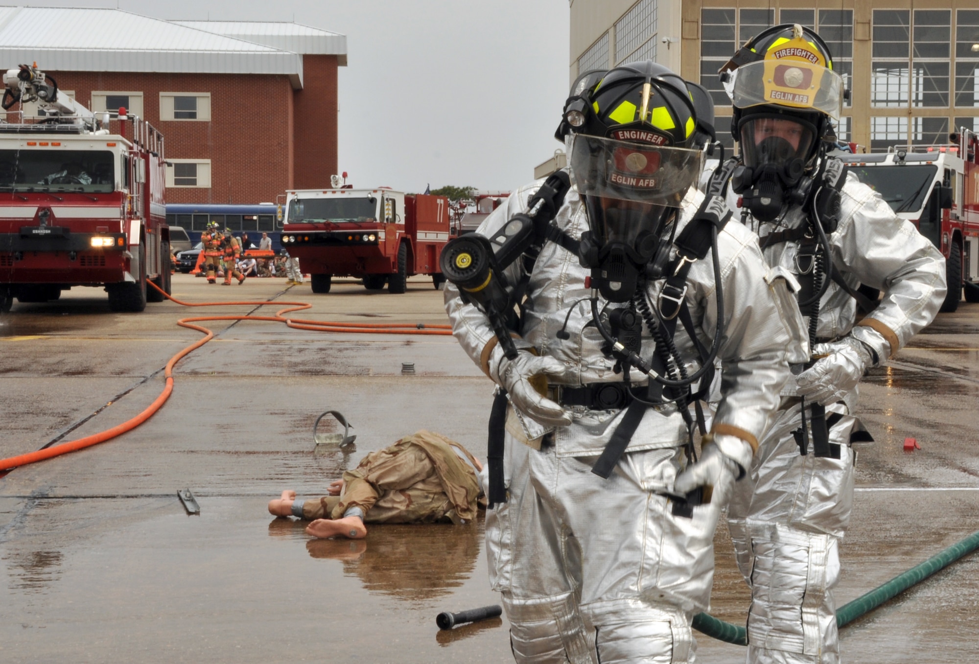 EGLIN AIR FORCE BASE, Fla. – 96th Civil Engineer Group firefighters advance on a simulated crashed aircraft during a Major Accident Response Exercise here, March 24. The event simulated an aircraft crash to test how quickly Eglin’s first responders could react to a catastrophe and effectively treat victims. (U.S. Air Force photo/ Airman 1st Class Anthony Jennings)