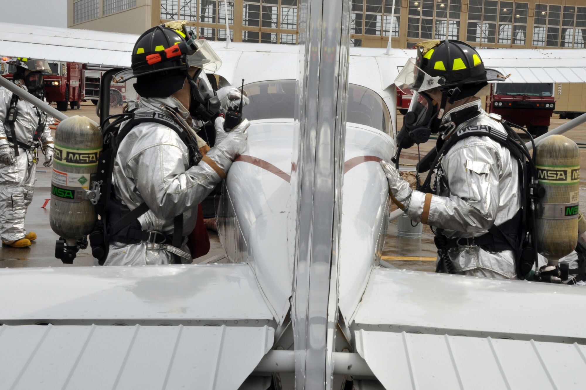 EGLIN AIR FORCE BASE, Fla. – 96th Civil Engineer Group firefighters inspect a simulated crashed aircraft for potentially hazardous material during a Major Accident Response Exercise on the flight line, March 24. The event simulated an aircraft crash to test how quickly Eglin’s first responders could react to a catastrophe and effectively treat victims. (U.S. Air Force photo/ Airman 1st Class Anthony Jennings)