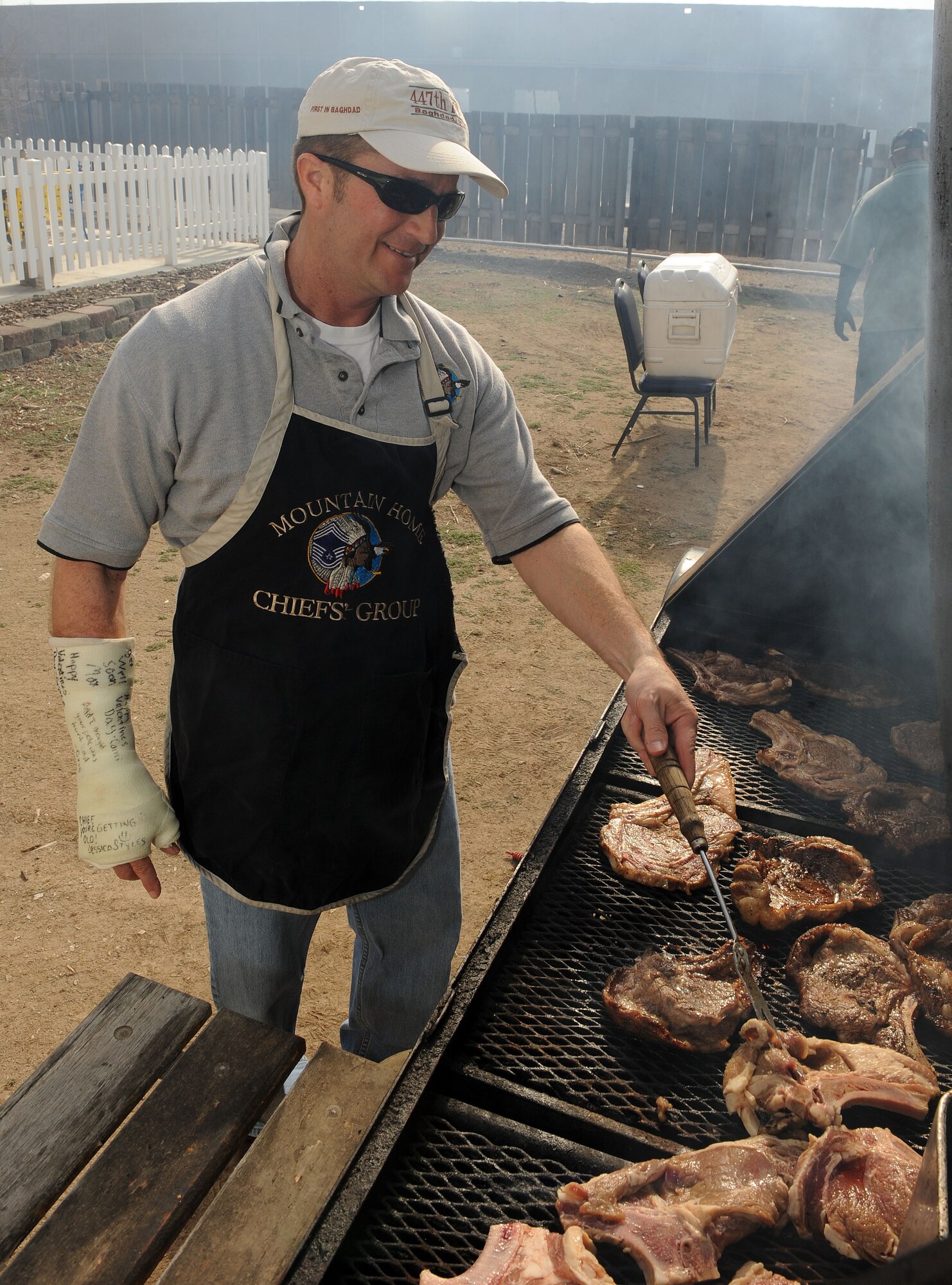 MOUNTAIN HOME AIR FORCE BASE, Idaho -- Chief Master Sgt. Richard Cain, 366th Logistics Readiness Squadron group enlisted manager, grills steaks at the community center during the Chief’s Steak Burn March 17. Money raised from the steak burn helps offset costs of quarterly and annual awards. (U.S. Air Force photo by Airman 1st Class Debbie Lockhart)