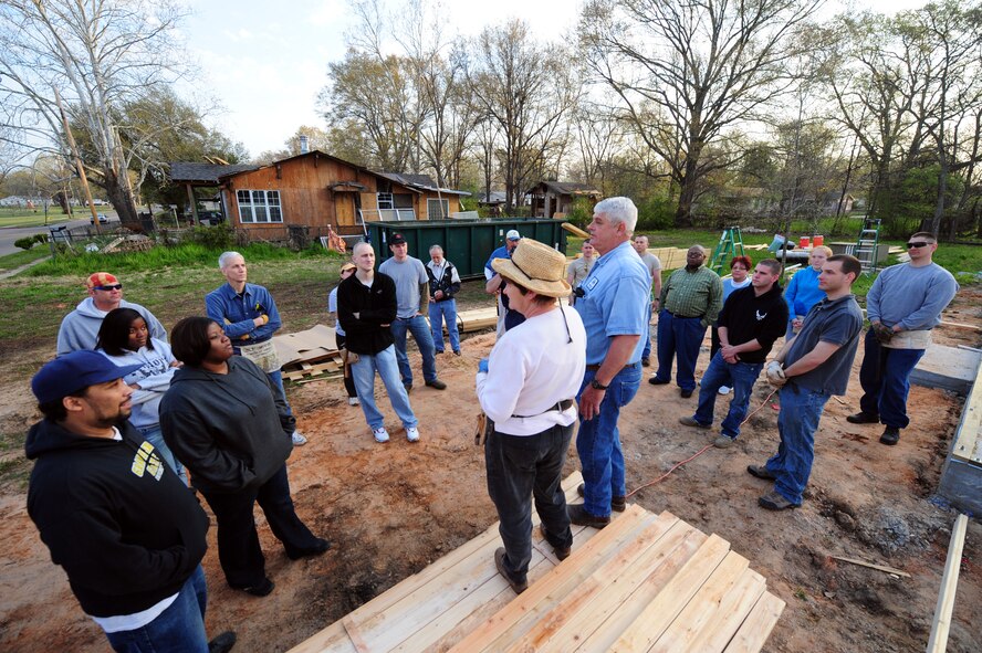 SHREVEPORT, La. – Members of the local community and Airmen from Barksdale Air Force Base receive a safety briefing from Habitat for Humanity volunteers before beginning construction of a new home March 20. More than 20 Barksdale Airmen from the 2d Civil Engineer Squadron volunteered to help with the construction. (U.S. Air Force photo by Senior Airman Joanna M. Kresge)