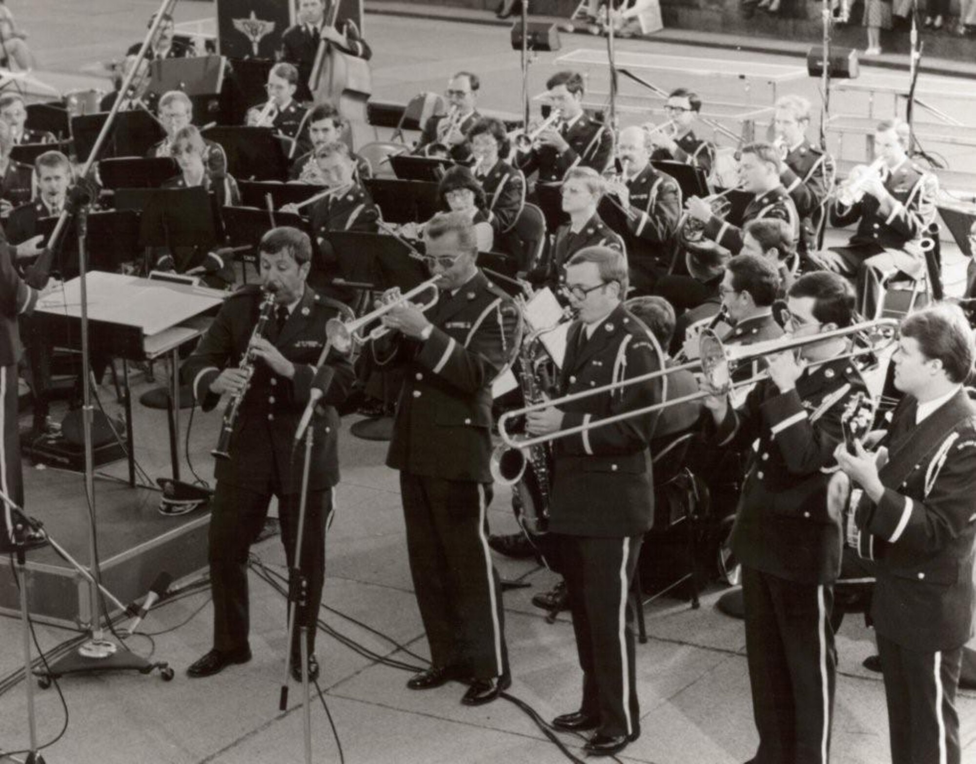 Concert Band Dixie Ensemble, performing the Dixie portion of "A Clarinet Chronology" (L to R): Jim Murphy, Jim Hutchinson, Keith Young, Bruce Bevans and Walt Johns, with Colonel Arnald D. Gabriel conducting. This is Photo 29. (Unknown Photographer)