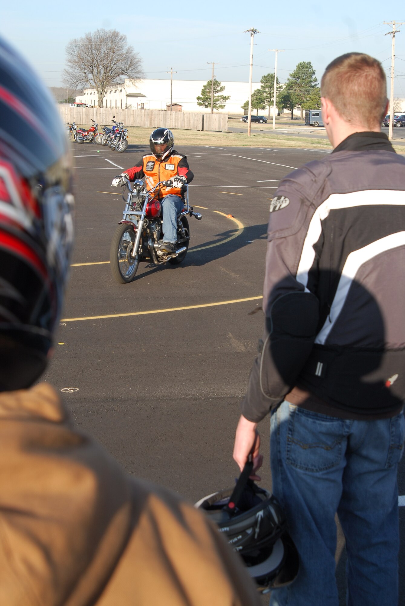 Base personnel observe a motorcyclist training on the base motorcycle pad March 19. The pad is the base’s first Sports Bike and Motorcycle Safety Foundation certified training pad, which is available to more than 610 motorcycle riders. The $154,000 asphalt surface was designed specifically for the rider training courses. (U.S. Air Force photo by Staff Sgt. Juan Torres)