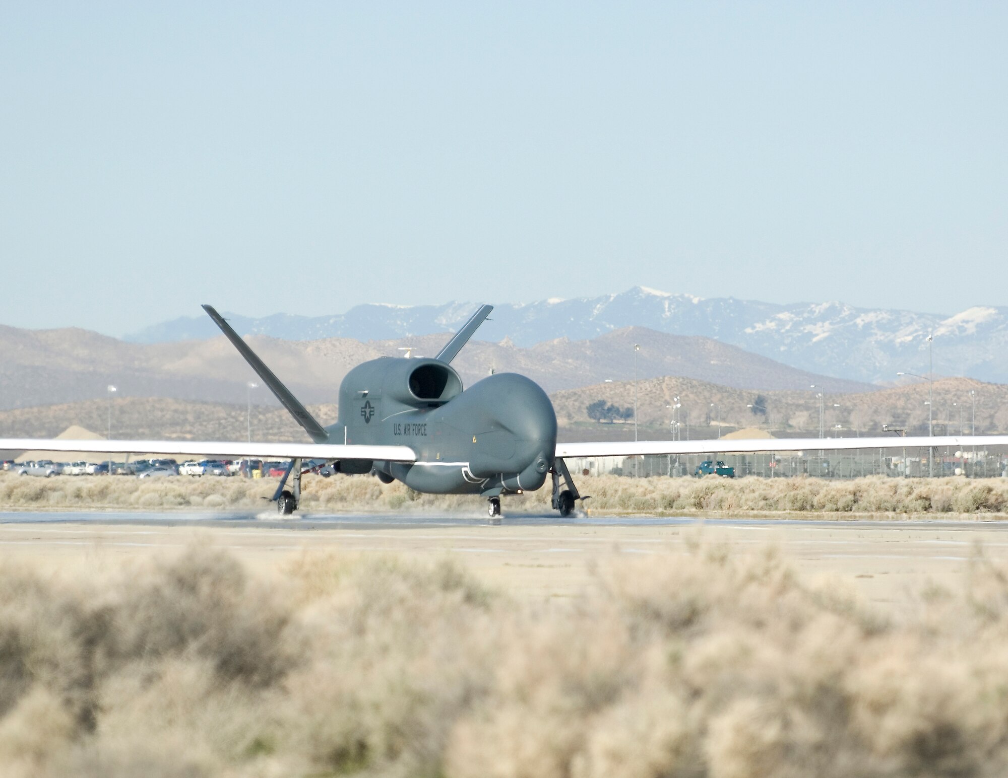A RQ-4B Global Hawk completes a wet runway test March 12.  452nd Flight Test Squadron will wrap up its Block 20 wet runway testing around the beginning of April. (Courtesy photo)  