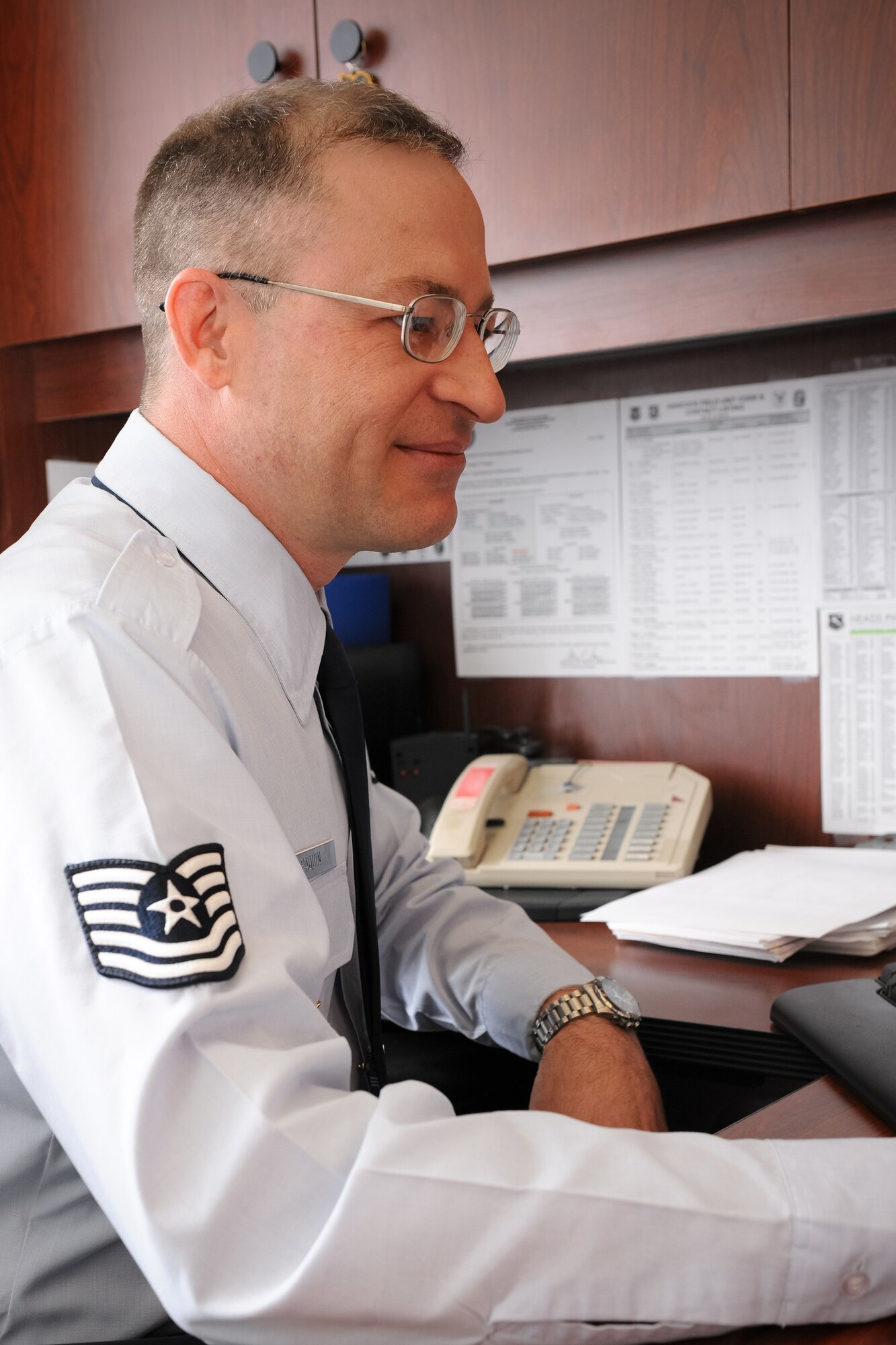 Technical Sgt. Julien Paquin looks over documents relating to a potential recruit for the 174th Fighter Wing.  TSgt Paquin is one of two recruiters with the 174th Fighter Wing who received the "Top Performers" award for weekly accessions.  (US Air Force photo by Staff Sgt. Lee O. Tucker/Released)