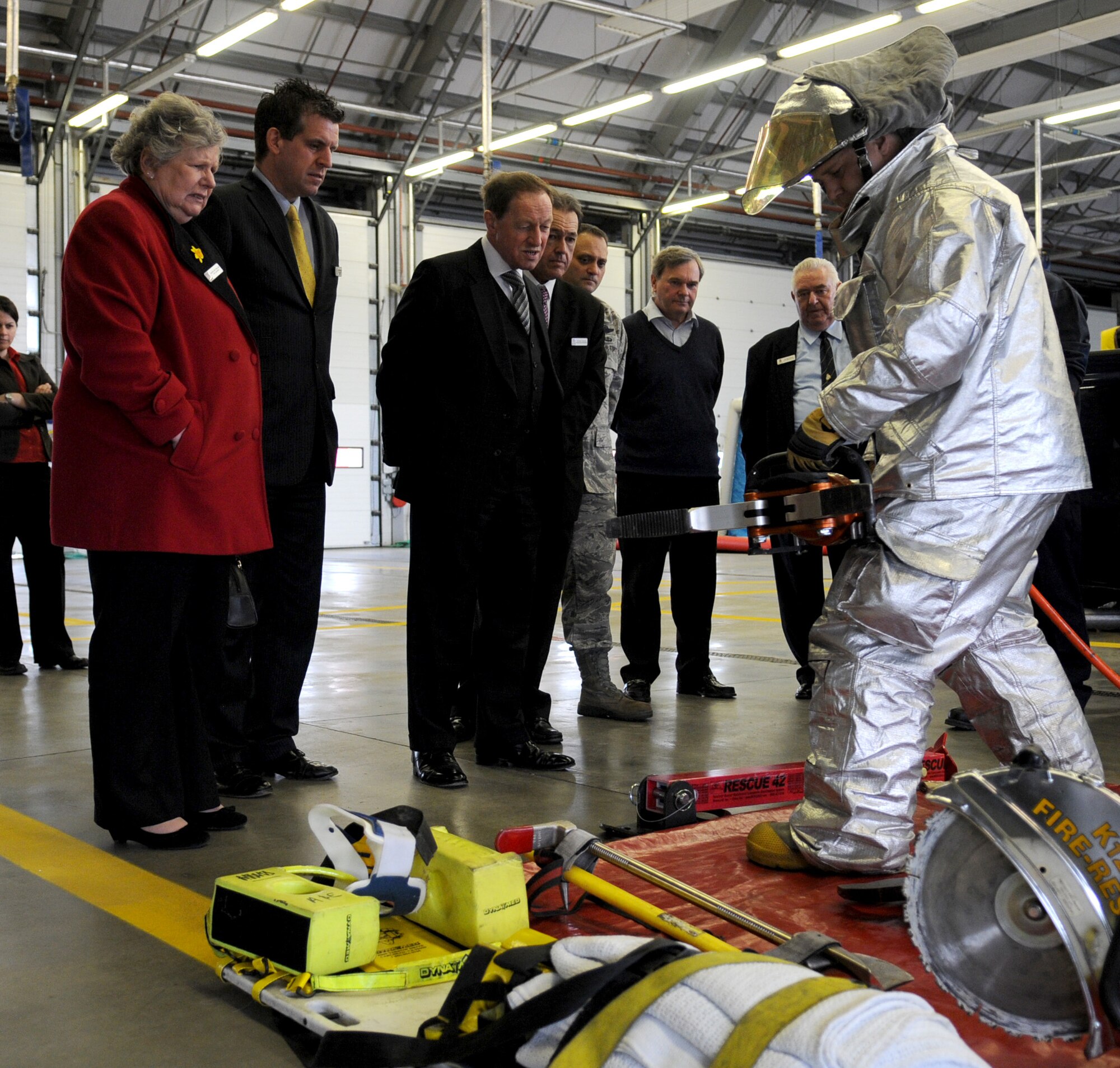 RAF MILDENHALL, England – Staff Sgt. Christopher Smiley, 100th Civil Engineer Squadron Fire Department, gives Forest Heath District Council members a demonstration of rescue tools such as hydraulic cutters also known as the Jaws of Life at the fire department March 25. The council members were invited by wing leadership for a base tour to reinforce relationships between the base and local community. (U.S. Air Force photo/ Staff Sgt. Jerry Fleshman)