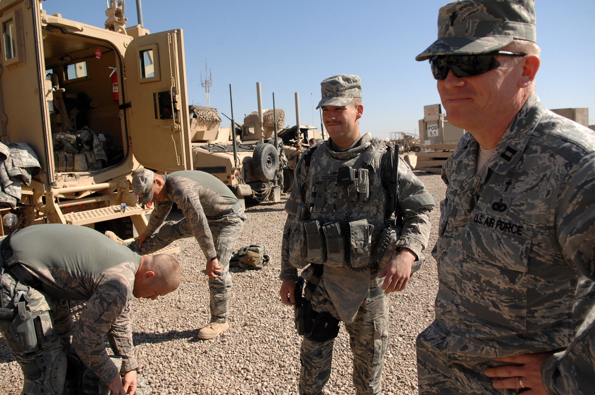 Chaplain (Capt.) Steve Fisher, 732nd Air Expeditionary Group chaplain, visits with 732nd AEG Security Forces Squadron Airmen as they prepare for a mission outside-the-wire. Chaplain Fisher visited more than 100 Airmen while on his mission to provide pastoral access and care for Joint Expeditionary Tasking Airmen. (U.S. Air Force photo/ Airman 1st Class Allison M. Boehm/Released)
