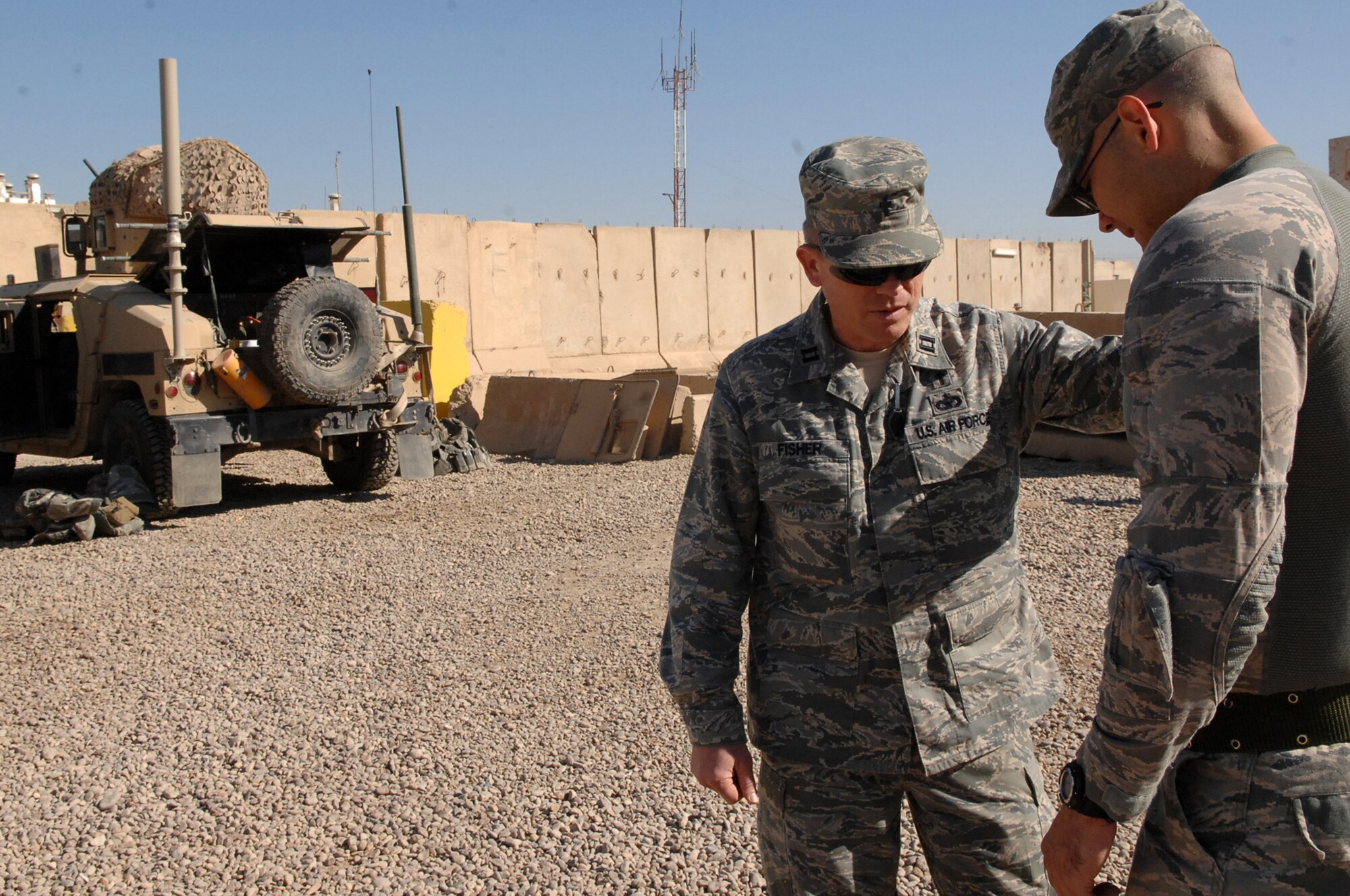 Chaplain (Capt) Steve Fisher, 732nd Air Expeditionary Group chaplain, prays with Staff Sgt. Thomas Bonte, 732nd AEG Security Forces Squadron vehicle driver before a mission outside-the-wire. While making small-talk with the Airmen, Chaplain Fisher also ensured any spiritual needs from the Airmen were met before he left. (U.S. Air Force photo/ Airman 1st Class Allison M. Boehm/Released)