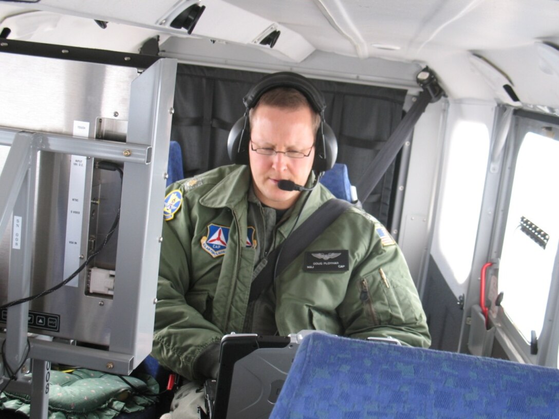 Civil Air Patrol Maj. Doug Ployhar operates CAP’s ARCHER system during disaster relief operations in the Red River Valley, which separates Minnesota and North Dakota. ARCHER (Airborne Real-time Cueing Hyperspectral Enhanced Reconnaissance) is an aerial imaging system that produces high-resolution aerial images that assist emergency management officials in their assessment of flood damage.
Photo by Lt. Col. Paul Adams, Minnesota Wing
