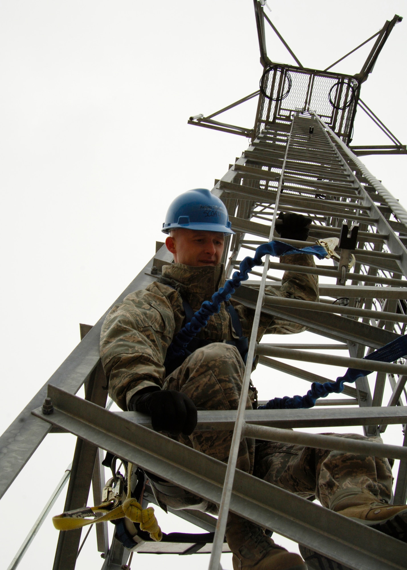 Staff Sgt. Douglas McNeill, 22nd Communications Squadron airfield systems NCOIC, climbs a 70 foot radio tower located on the ground, air, transmit and receive site March 16, 2010, at McConnell Air Force Base, Kan. Airmen from the 22nd CS provide periodic and preventative maintenance on equipment mounted on the tower to ensure command post, base operations, base weather and the air traffic control tower have proper communication signals. (U.S. Air Force photo/Airman 1st Class Andrea Salazar)