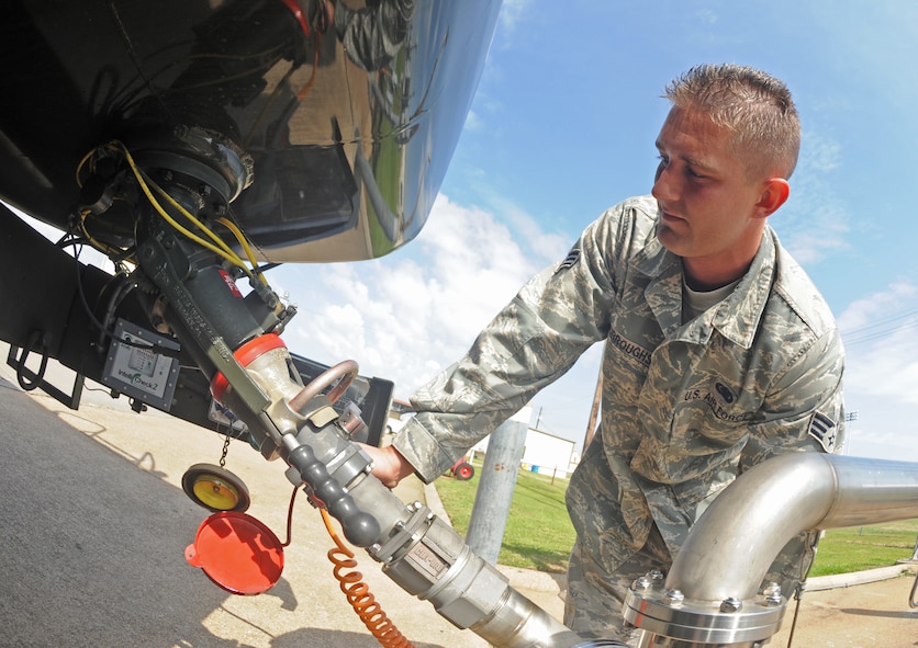 BARKSDALE AIR FORCE BASE, La. – Senior Airman Christopher Burroughs, 2d Logistics Readiness Squadron, is fueling an R-11 refueling truck March 24. An R-11 truck holds up to 6,000 gallons of fuel and is used to refuel aircraft that is not parked near a hydration system for underground refueling. (U.S. Air Force photo by Senior Airman Alexandra Longfellow) (RELEASED)