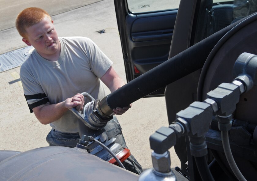 BARKSDALE AIR FORCE BASE, La. – Airman Alex Bellerud, 2d Logistics Readiness Squadron, rolls the fuel nozzle back on the refueling truck March 24. Barksdale has five different types of refueling trucks for a total of 25 trucks in the refueling fleet. (U.S. Air Force photo by Senior Airman Alexandra Longfellow) (RELEASED)