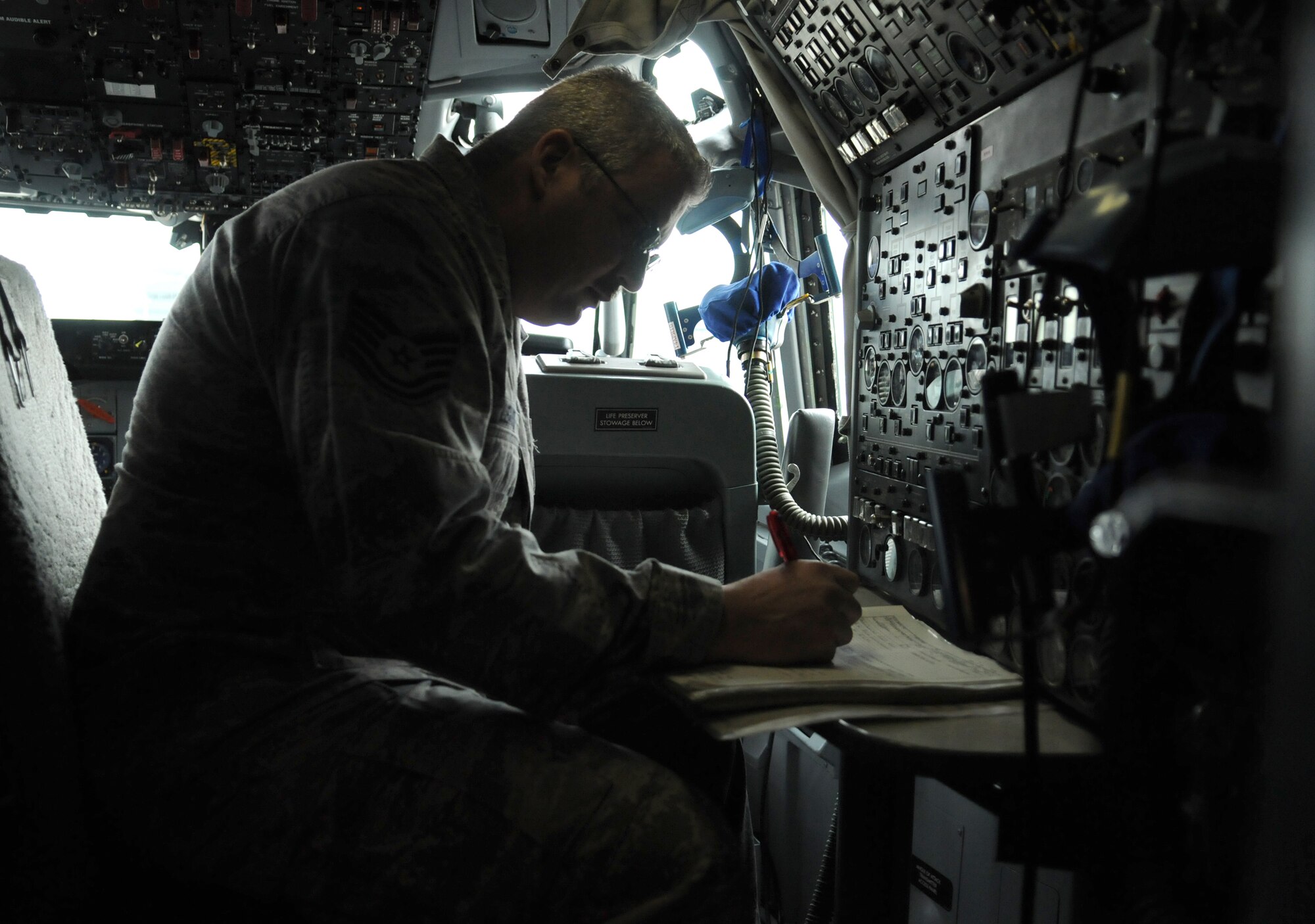 NATO AIR BASE GEILENKIRCHEN, Germany – Tech. Sgt. Richey Leamer, NATO E-3A Airborne Early Warning and Control force component E-3A Sentry crew chief, performs a preflight checklist in the cockpit of an E-3A March 19. The E-3A is a four-engine, modified Boeing 707-320 aircraft that provides all-weather surveillance, command, control and communications needed by the commanders of NATO air forces. The component’s mission is to provide aircraft and trained aircrews to deliver a surveillance and/or control platform whenever directed by the NATO AWACS commander on behalf of the supreme allied commander, Europe. (U.S. Air Force photo/Senior Airman Nathanael Callon)