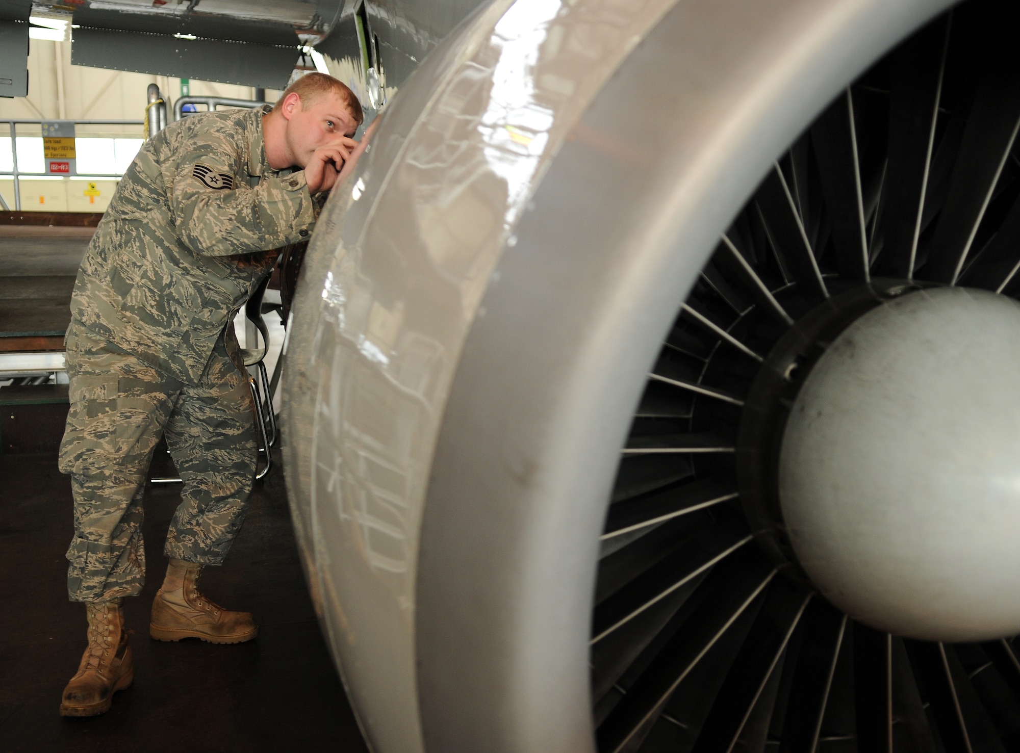 NATO AIR BASE GEILENKIRCHEN, Germany – Staff Sgt. Charles Dalton, NATO E-3A Airborne Early Warning and Control force component logistics wing aircraft phase technician, inspects the electronics on an E-3A Sentry engine March 19. The E-3A is a four-engine, modified Boeing 707-320 aircraft that provides all-weather surveillance, command, control and communications needed by the commanders of NATO air forces. (U.S. Air Force photo/Senior Airman Nathanael Callon)