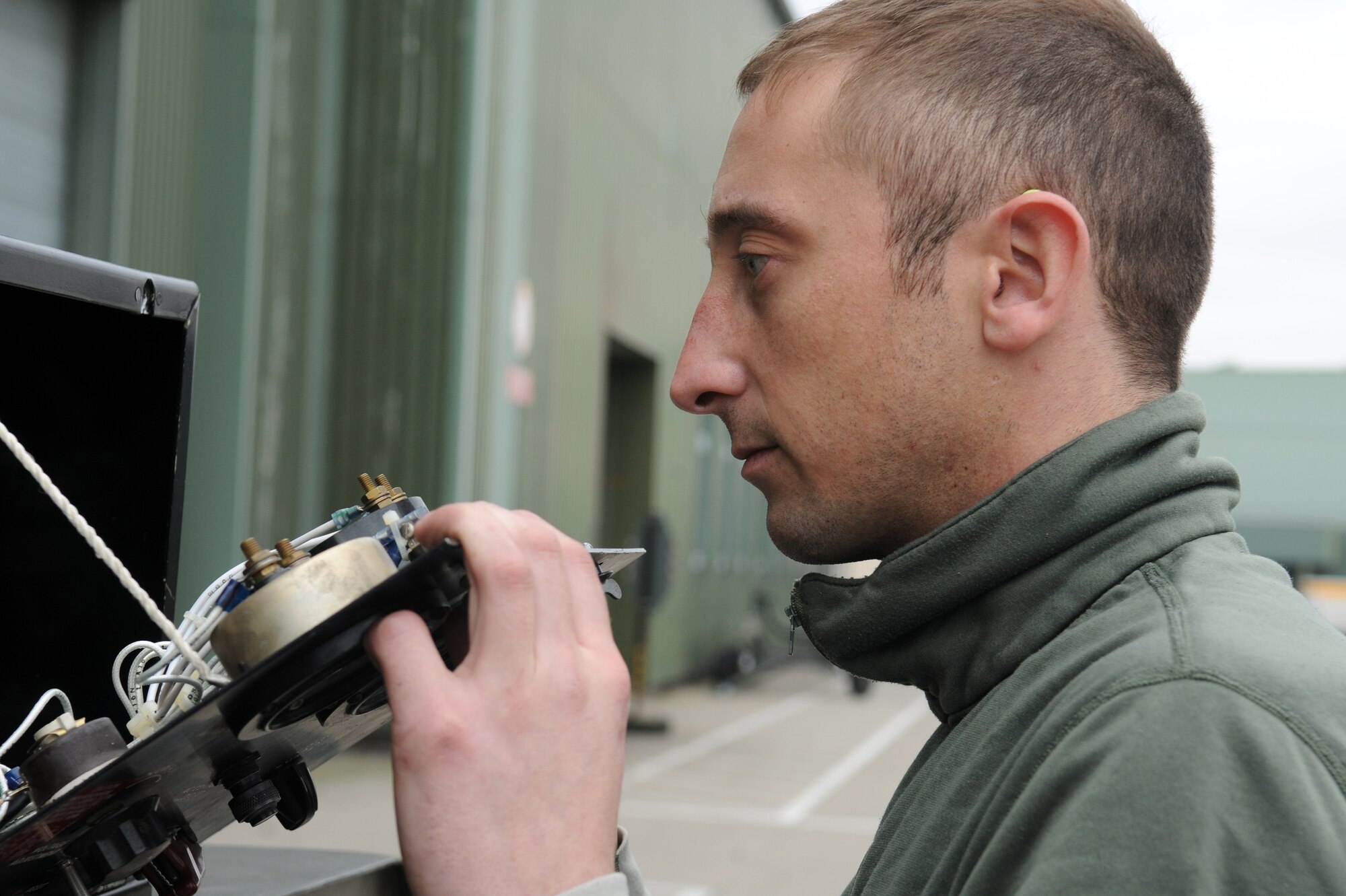 NATO AIR BASE GEILENKIRCHEN, Germany – Senior Airman Michael Miller, NATO E-3A Airborne Early Warning and Control force component aerospace ground equipment journeyman, performs generator maintenance at a hangar March 19. The Component’s mission is to provide aircraft and trained aircrews to deliver a surveillance and/or control platform whenever directed by the NATO AWACS commander on behalf of the supreme allied commander, Europe. (U.S. Air Force photo/Senior Airman Nathanael Callon)