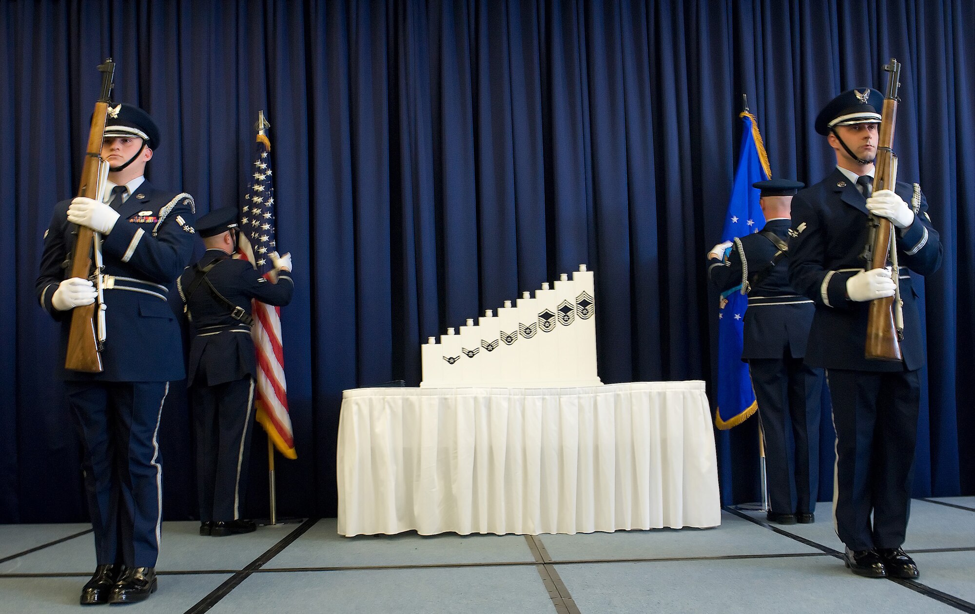 Honorguard members post colors during the 512th Airlift Wing Senior NCO Induction Ceremony March 6 at The Landings Club. (U.S. Air Force photo/Brianne Zimny)