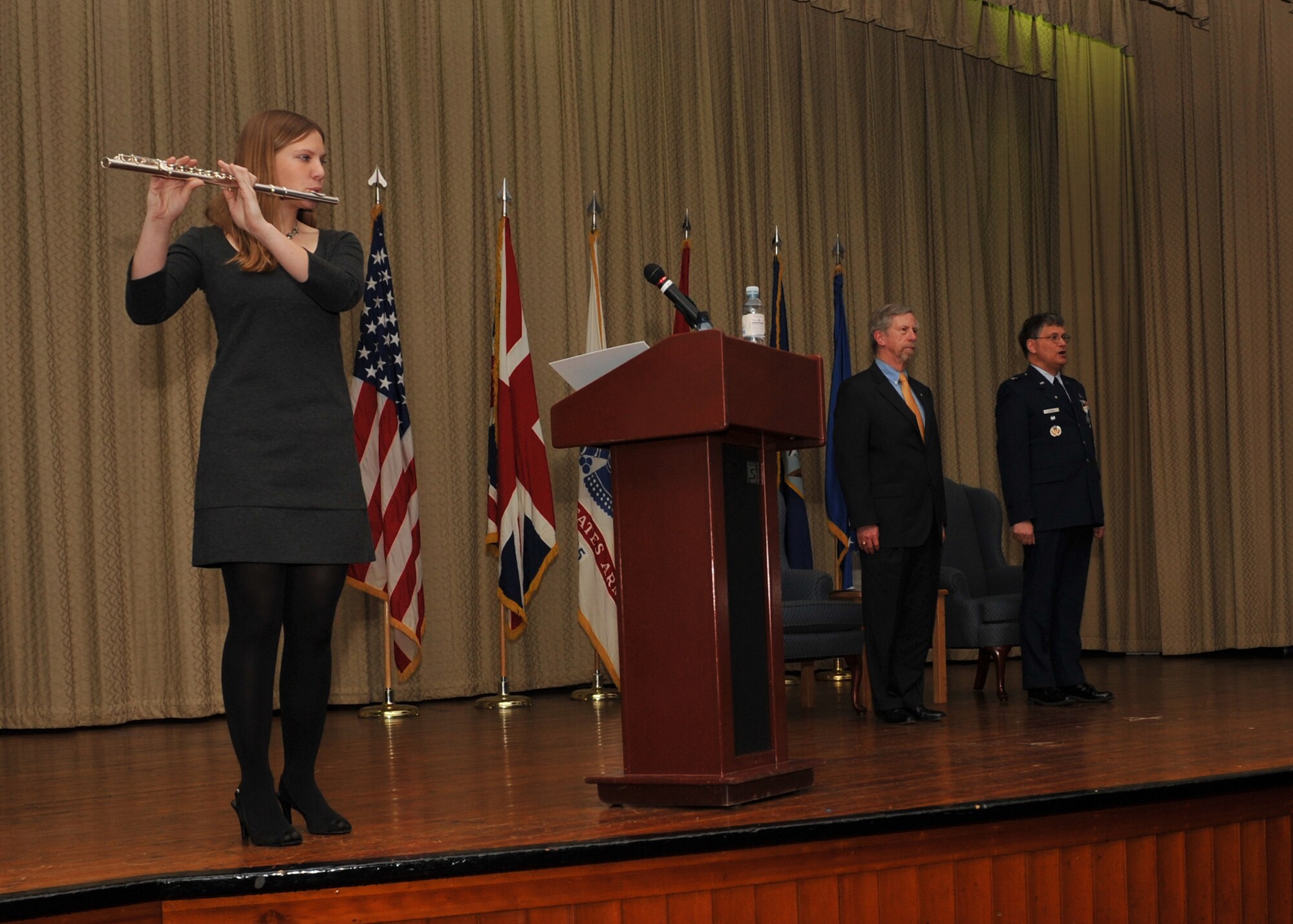 Katherine Stiegel plays the Air Force Song during the retirement ceremony for her father, Colonel Robert G. Stiegel, on Mar. 18, 2010.  (Photo by U.S. Air Force Staff Sgt. Javier Cruz)