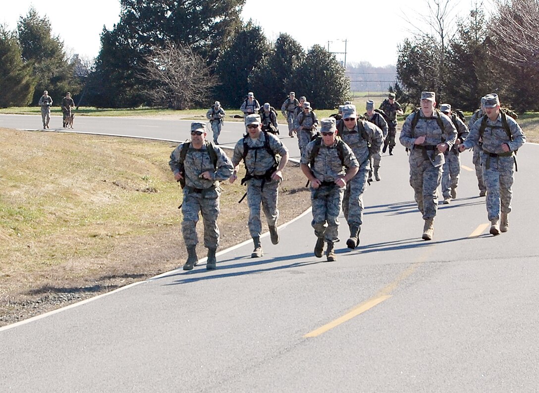 Members from the Air Force Mortuary Affairs Operations Center here participate in the 436th Security Forces Squadron's 11th Annual Ruck March held March 20, 2010, at Dover Air Force Base, Del. The annual 6.2-mile march is a fundraiser to honor the veterans of the Korean War who fought in the Battle of the Chosin Reservoir. (U.S. Air Force photo/Master Sgt. Robert Snyder)