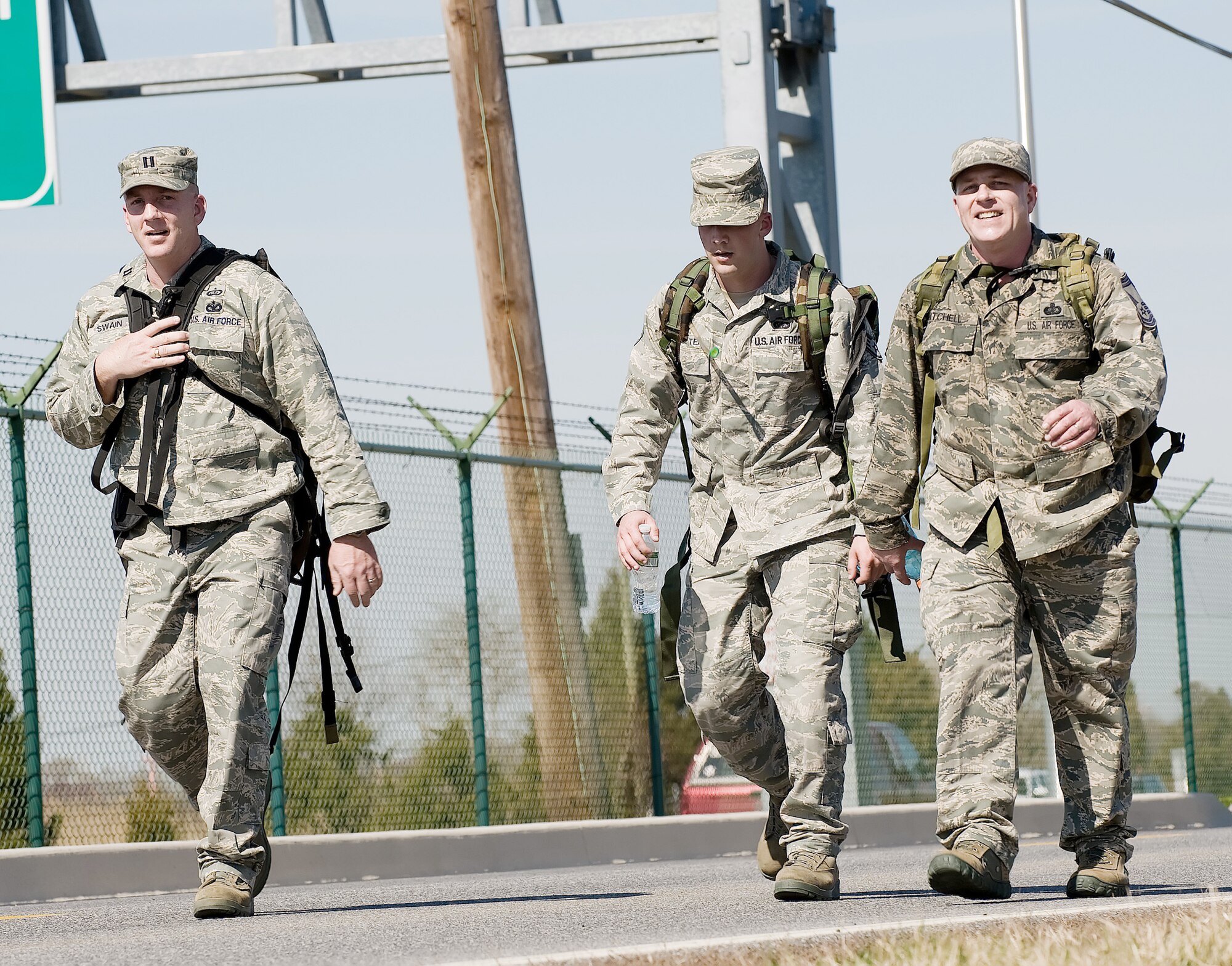 Capt. Gordon Swain (from left), Senior Airman Jason Saulter and Senior Master Sgt. Richard Mitchell participate in the 436th Security Forces Squadron's 11th Annual Ruck March held March 20, 2010, at Dover Air Force Base, Del. The annual 6.2 mile march is a fundraiser to honor the veterans of the Korean War who fought in the Battle of the Chosin Reservoir. Captain Swain is the Air Force Mortuary Affairs Operations Center dignified transfer officer in charge, Airman Saulter is a AFMAO dignified transfer team member, and Sergeant Mitchell is the AFMAO uniforms section chief. (U.S. Air Force photo/Jason Minto)