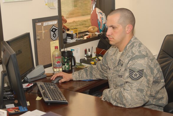 ALTUS AIR FORCE BASE, Okla. - Recently promoted Technical Sgt., Peter Rollins, of the 97th Air Mobility Wing Equal Opportunities Office, works at his computer on Mar. 4. Rollins was selected for a Stripes for Exceptional Performers promotion because of his dedication, positive attitude and commitment to the Air Force core values.  (U.S. Air Force photo/Airman 1st Class Christopher A. Arnold)