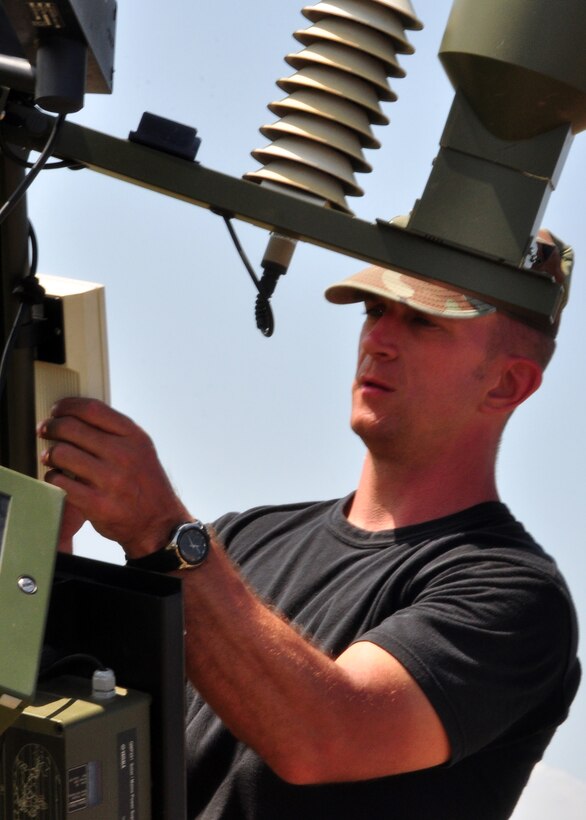 Technical Sgt. Bill Bayer, 612th Air Base Squadron, calibrates the tactical metrological equipment March 22 here so he can provide accurate weather observations to aircrews before they step to their aircraft. Sergeant Bayer is one of 49 Joint Task Force-Bravo members deployed in support of Joint Task Force-Haiti. (U.S. Air Force photo/Staff Sgt. Bryan Franks)