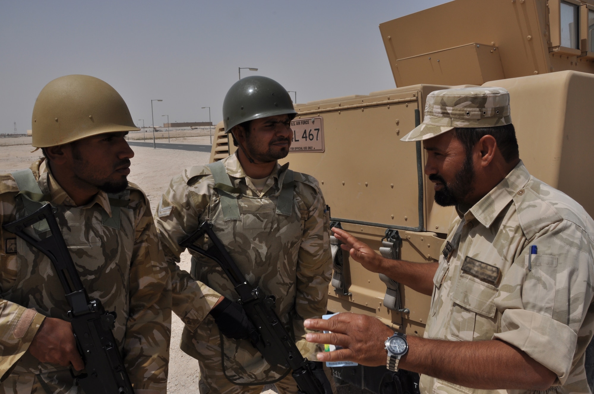 Host-nation forces discuss how to proceed during the next step of an exercise scenario at a non-disclosed Southwest Asia location March 23, 2010. (U.S. Air Force photo by Capt. Patrick Cordova)[RELEASED]