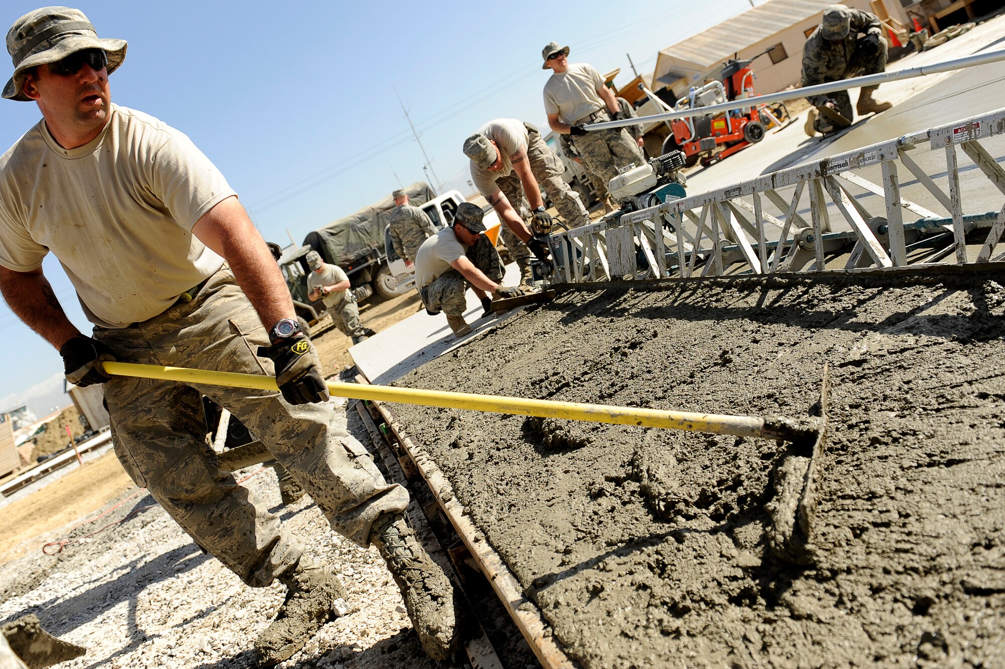 U.S. Air Force Senior Master Sgt. Nate Colborn, 577th Expeditionary Prime BEEF Squadron fills in the low spots of a cement pad at Bagram Airfield, Afghanistan, March 24, 2010. Sergeant Colborn is deployed from Grisson Air Reserve Base, Ind., and is from Mishawaka, Ind. (U.S. Air Force photo by/ Tech. Sgt. Jeromy K. Cross/released)




