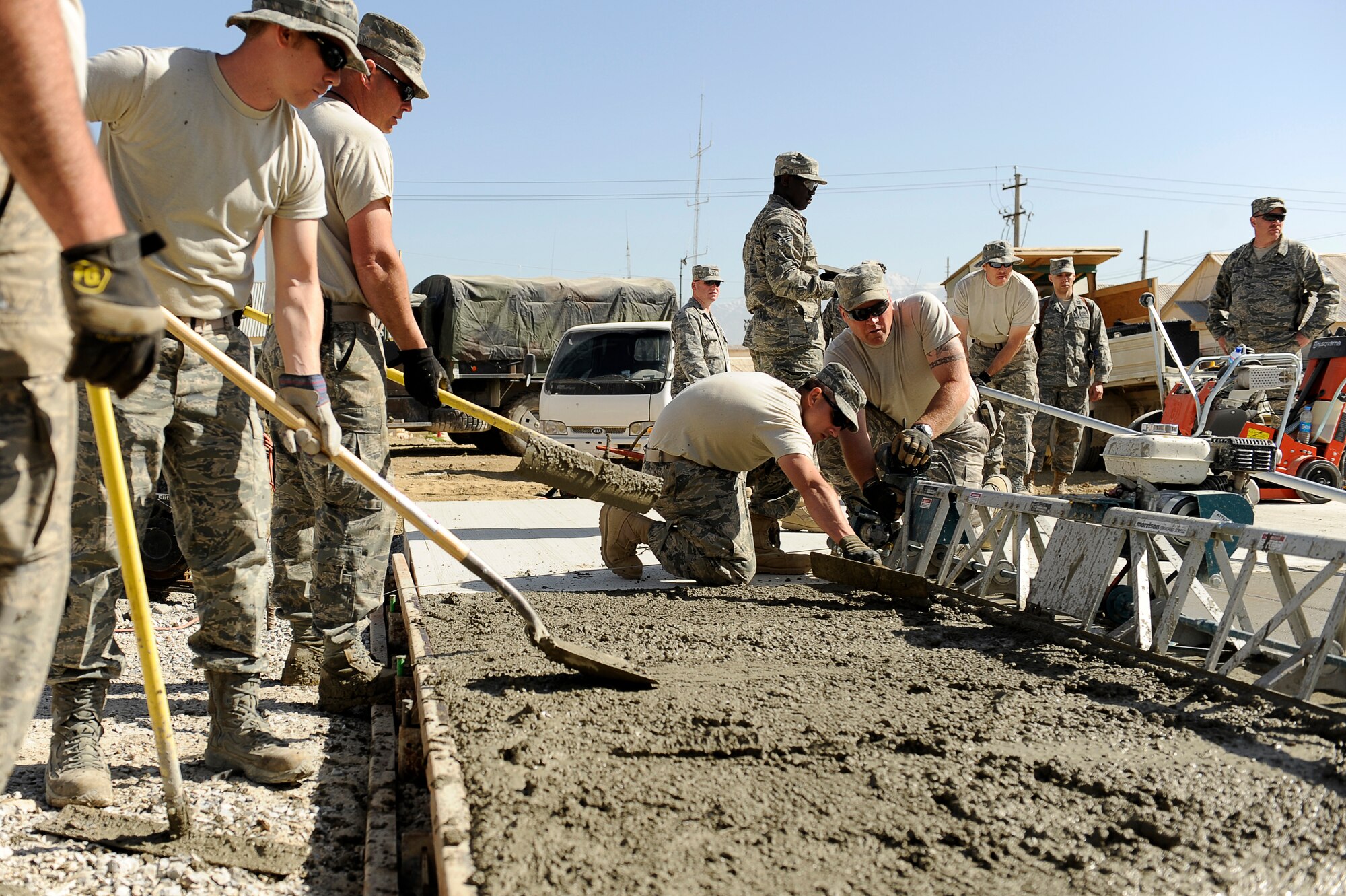 U.S. Air Force Airmen with the 577th Expeditionary Prime BEEF Squadron pour a cement pad at Bagram Airfield, Afghanistan, March 24, 2010. (U.S. Air Force photo by/ Tech. Sgt. Jeromy K. Cross/released)





