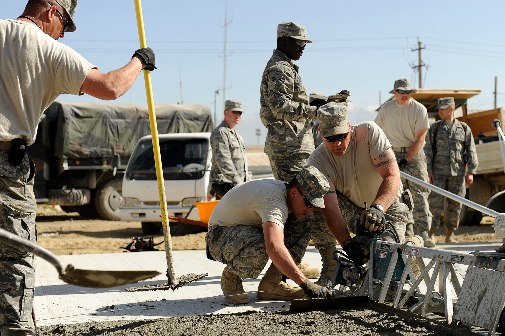 U.S. Air Force Airmen with the 577th Expeditionary Prime BEEF Squadron pour a cement pad at Bagram Airfield, Afghanistan, March 24, 2010. (U.S. Air Force photo by/ Tech. Sgt. Jeromy K. Cross/released)





