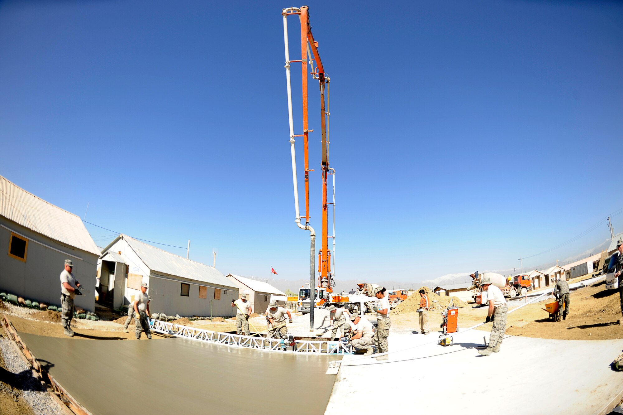 U.S. Air Force Airmen with the 577th Expeditionary Prime BEEF Squadron pour a cement pad at Bagram Airfield, Afghanistan, March 24, 2010. (U.S. Air Force photo by/ Tech. Sgt. Jeromy K. Cross/released)




