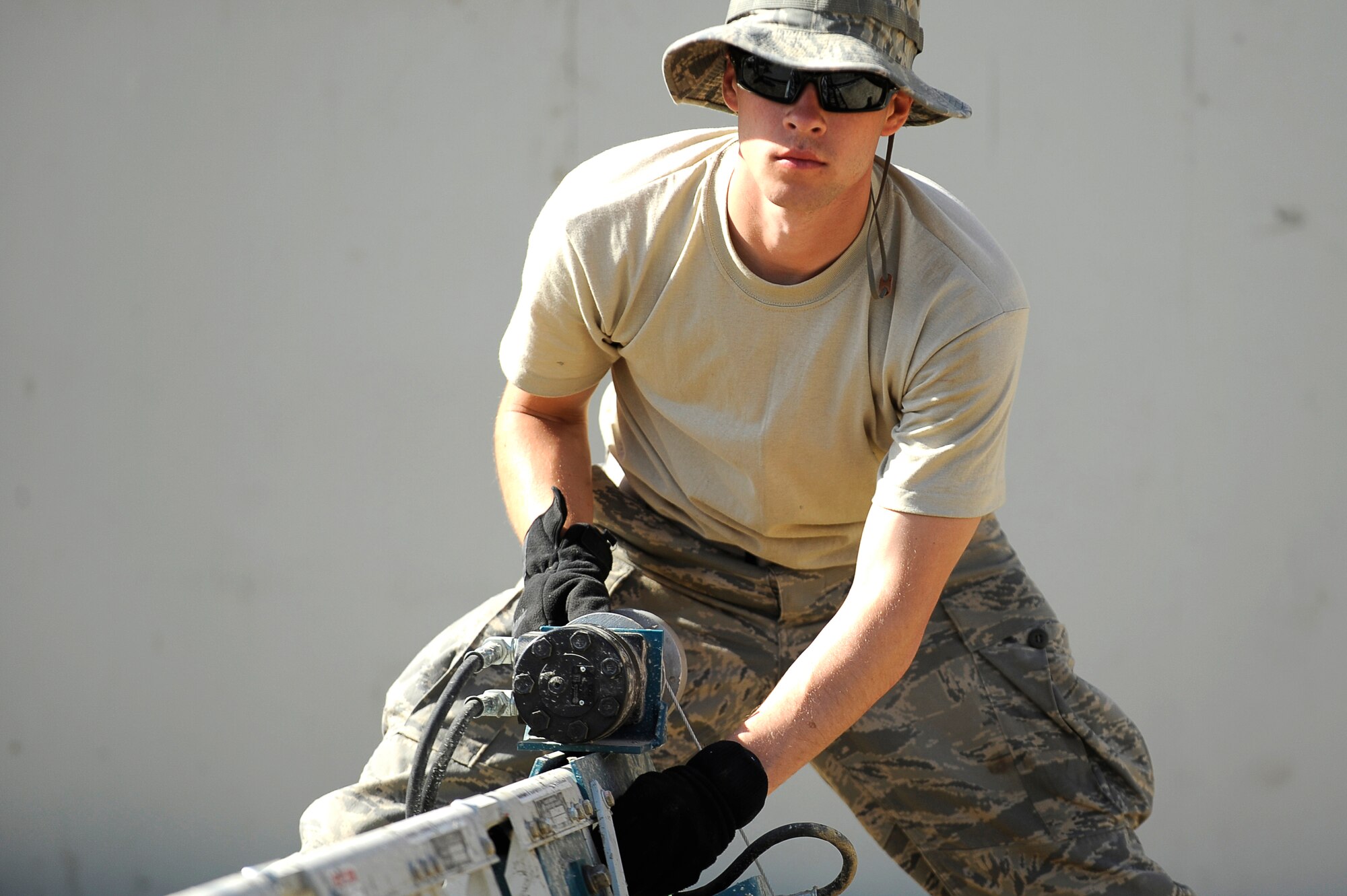 U.S. Air Force Senior Airman Mark Stidham, 577th Expeditionary Prime BEEF Squadron, smoothes down cement at Bagram Airfield, Afghanistan, March 24, 2010. Airman Stidham is deployed from Grisson Air Reserve Base, Ind., and is from Florence, Ky. (U.S. Air Force photo by/ Tech. Sgt. Jeromy K. Cross/released)





