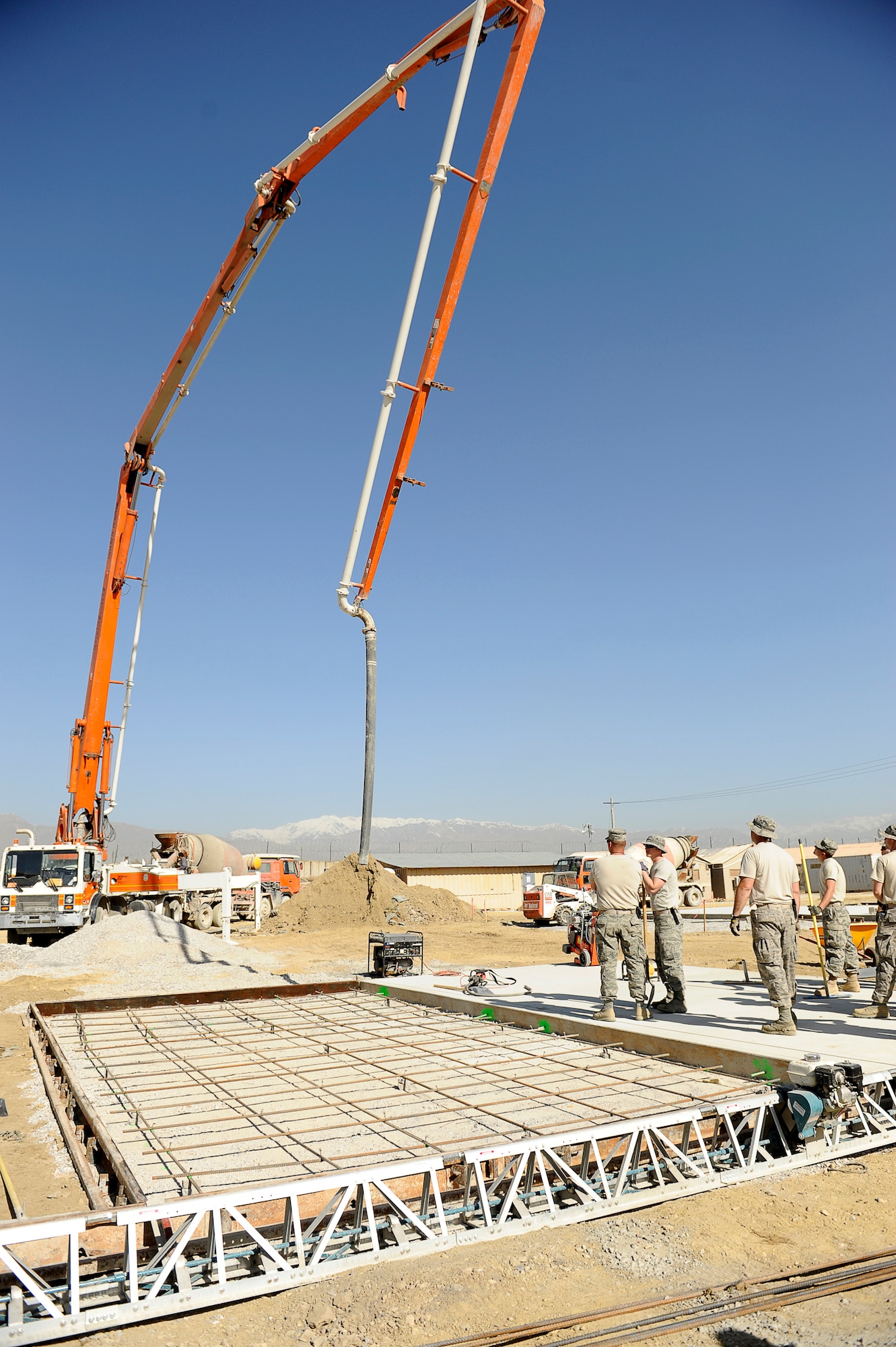 U.S. Air Force Airmen with the 577th Expeditionary Prime BEEF Squadron prepare to pour cement at Bagram Airfield, Afghanistan, March 24, 2010. (U.S. Air Force photo by/ Tech. Sgt. Jeromy K. Cross/released)




