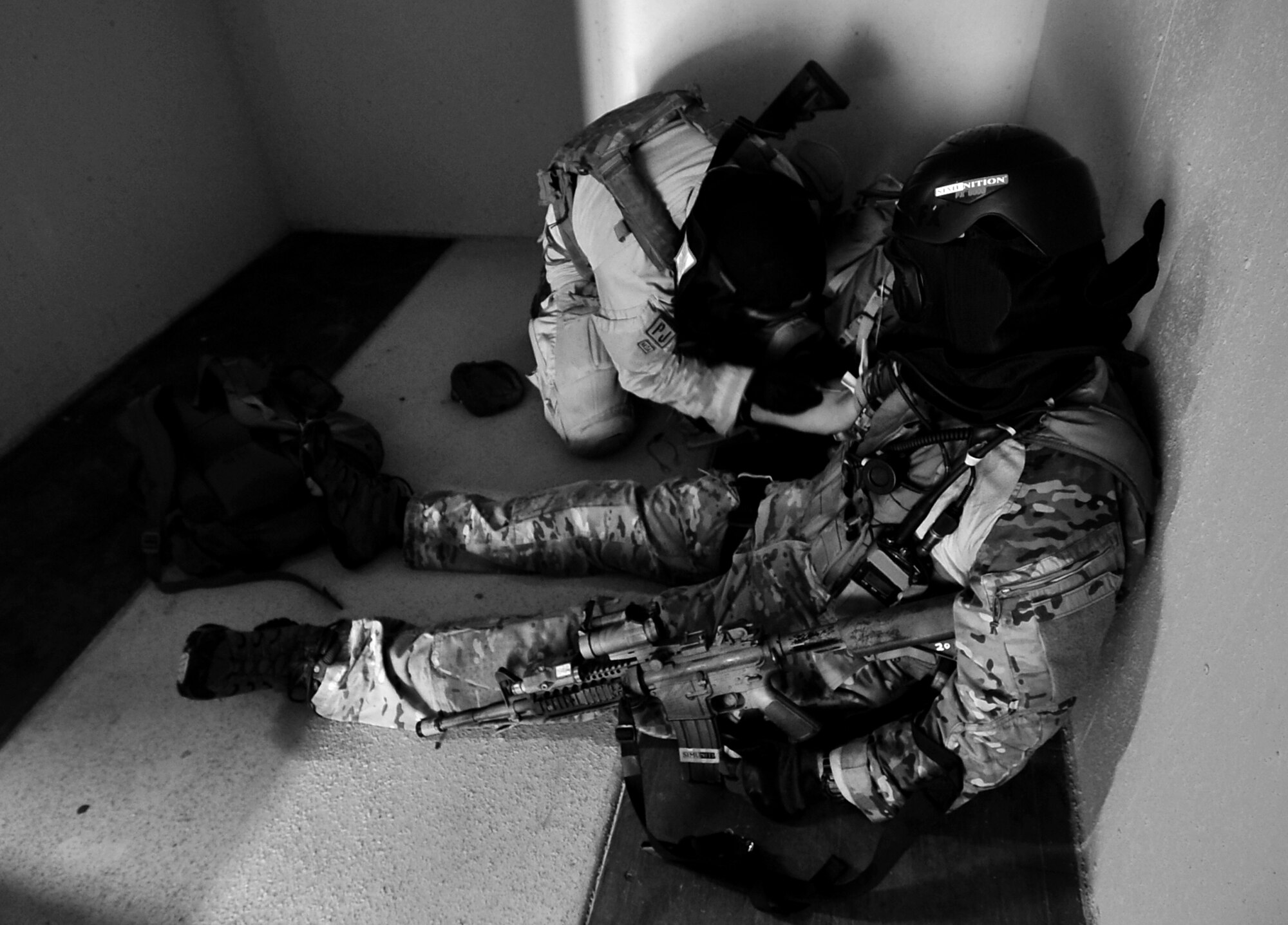 Members of the 31st Rescue Squadron come under enemy fire while they provide rescue and medical assistance in a simulated combat rescue operation in hostile territory at Camp Hansen during Beverly High 10-02 March 25, 2010. 
The training was part of a Local Operational Readiness Exercise designed to evaluate the readiness of Kadena Airmen.  (U.S. Air Force photo/Tech. Sgt. Rey Ramon)    