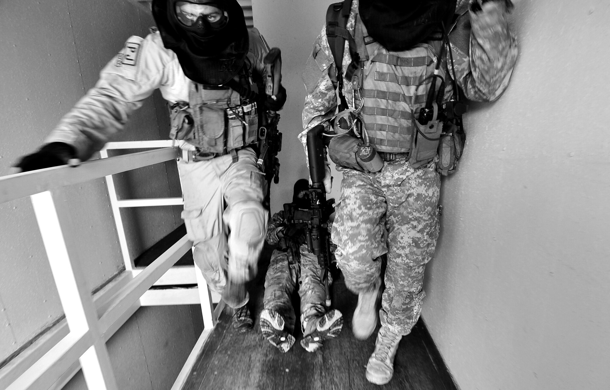 Members of the 31st Rescue Squadron come under enemy fire while they provide rescue and medical assistance in a simulated combat rescue operation in hostile territory at Camp Hansen during Beverly High 10-02 March 25, 2010. 
The training was part of a Local Operational Readiness Exercise designed to evaluate the readiness of Kadena Airmen.  (U.S. Air Force photo/Tech. Sgt. Rey Ramon)         