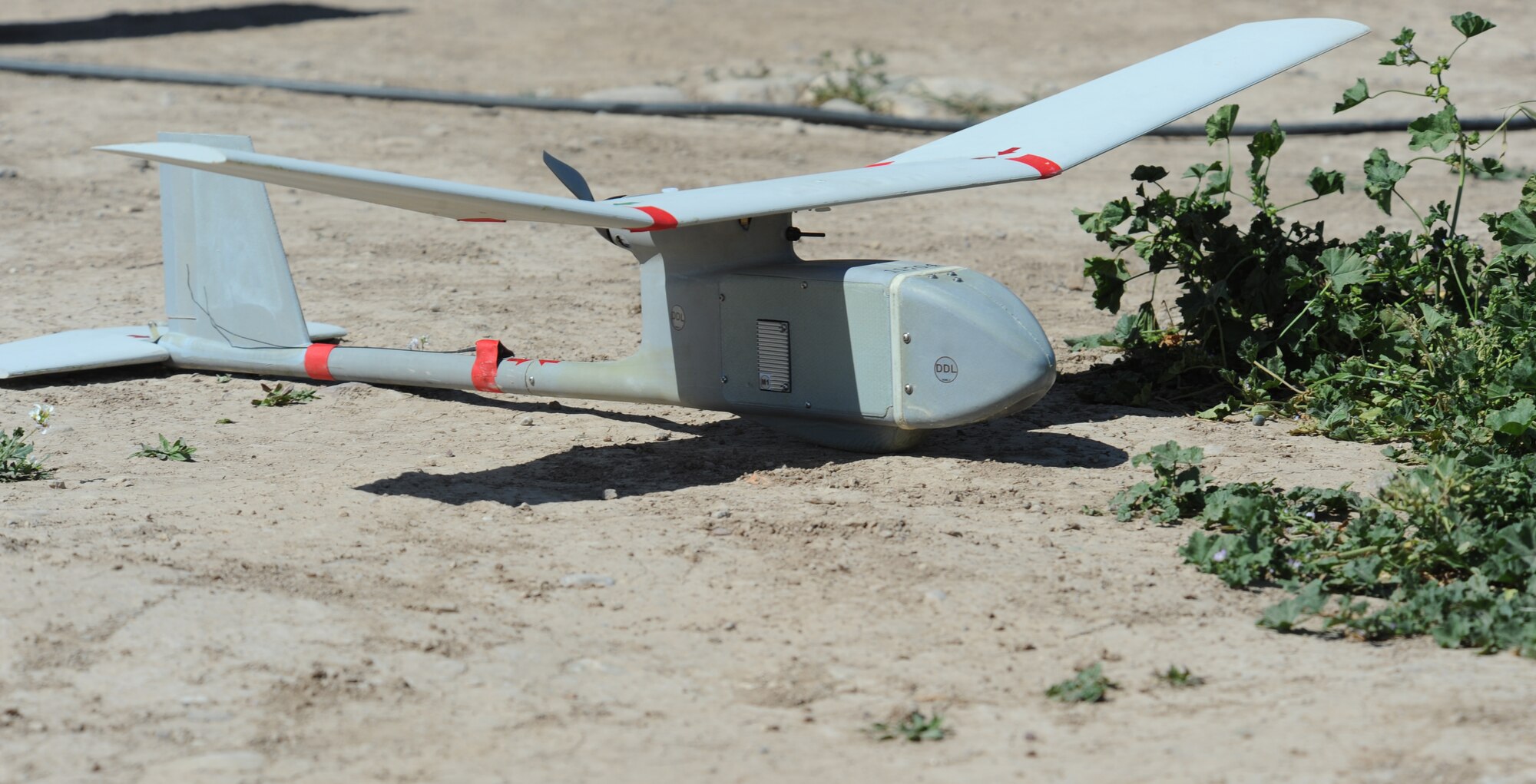 An operations check is done on a Raven-B unmanned aerial vehicle (UAV) by members of the 506th Expeditionary Security Forces Raven-B UAV team, before its launch at Kirkuk Regional Air Base, Iraq on March 23, 2010.  Raven-B is remotely piloted by a mission operator and vehicle operator who work side by side to coordinate on what they are seeing and what direction the device is flying. (U.S. Air Force photo/Staff Sgt. Tabitha Kuykendall/Released)