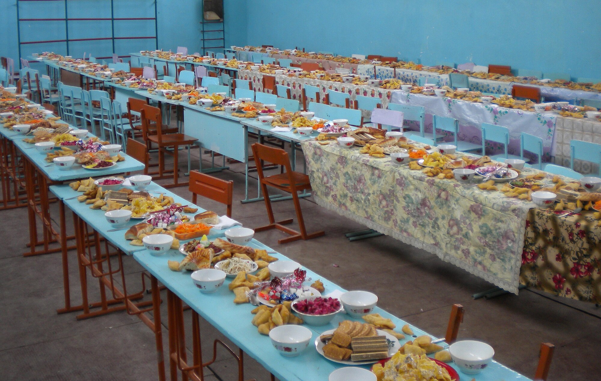 A feast sits ready to be eaten at the gym of the Tor-Kul School, Kyrgyzstan, during a celebration of the Nooruz holiday which Col. Blaine Holt, director of the Transit Center of Manas, and Chief Master Sgt. James Dowell, the enlisted leader of the Transit Center, also attended March 21, 2010. (U.S. Air Force photo/Chief Master Sgt. James Dowell/released)