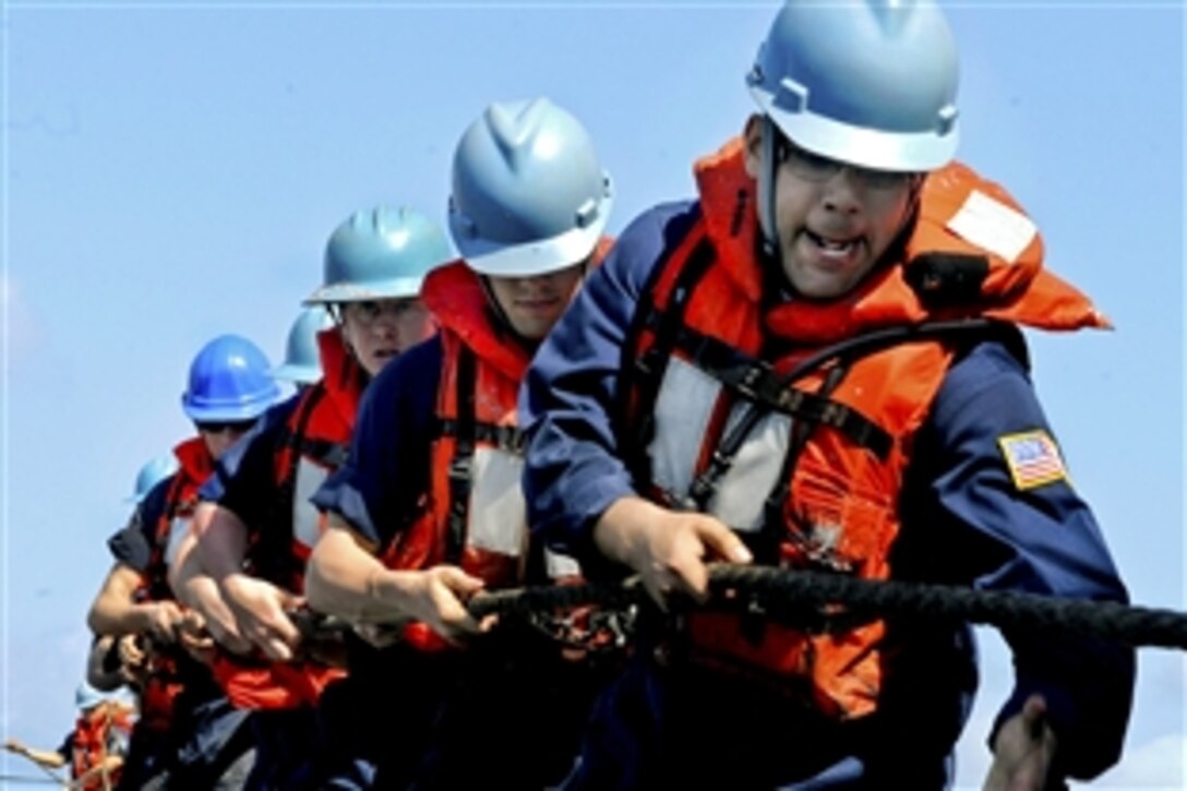 U.S. Navy sailors aboard the U.S. 7th Fleet command ship USS Blue Ridge heave a line during a replenishment at sea in the Pacific Ocean, March 24, 2010. The Blue Ridge is under way for a scheduled spring deployment.