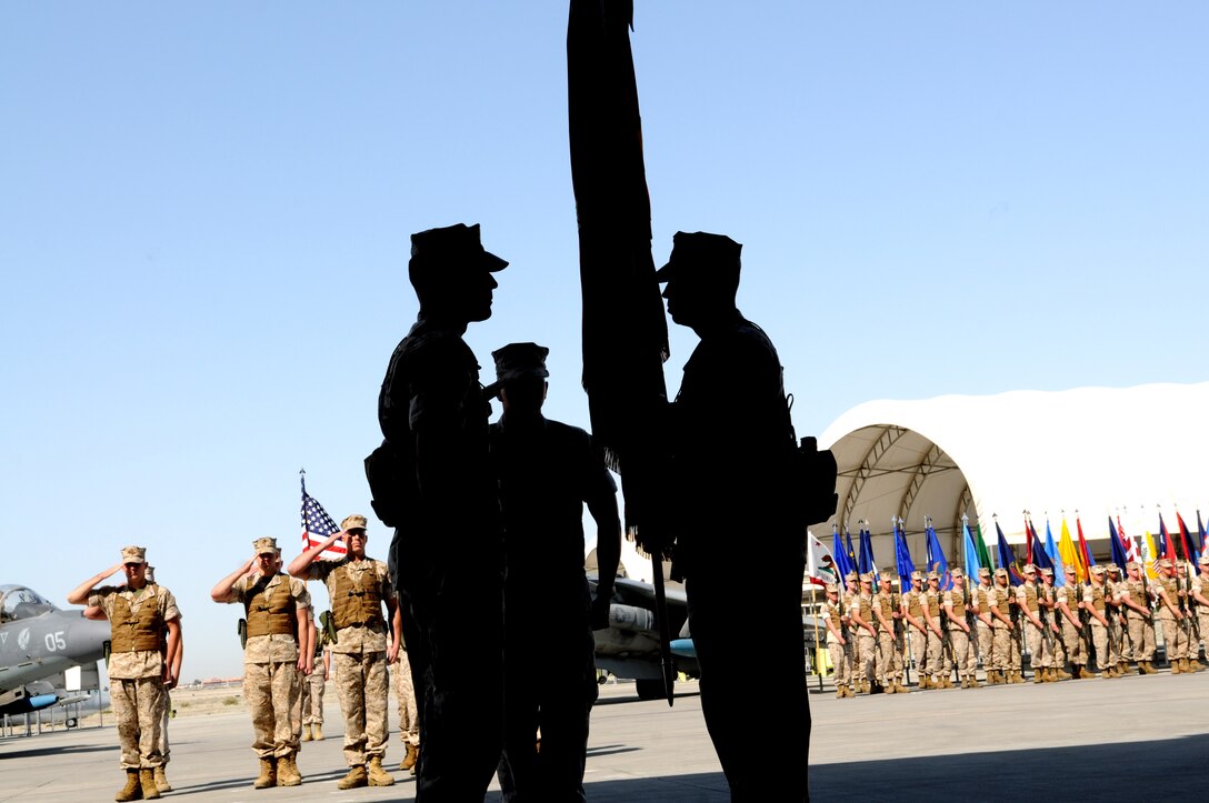 Lt. Col. Peter Lee, left, Marine Attack Squadron 513’s new commanding officer, receives the squadron’s colors from Lt. Col. Marcus Annibale, the Nightmare’s outgoing CO, at the squadron’s change of command ceremony in the squadron’s hangar at the Marine Corps Air Station in Yuma, Ariz., March 25, 2010. “This was my first squadron when I first got here as a young captain,” said Annibale. “I couldn’t be more satisfied to leave as its commander.” Annibale received the Navy and Marine Corps Commendation Medal at the end of the ceremony. Lee is coming from the North Africa Engagement Division at the Marine Corps Air Station in Miramar, Calif., while Annibale will be reporting to Quantico, Va.