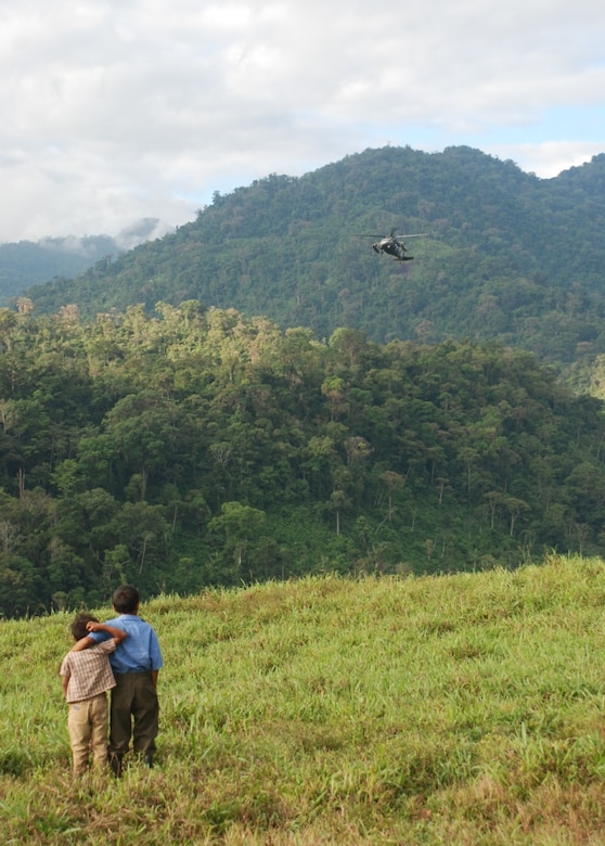Costa Rican boys watch as a U.S. Army HH-60 Blackhawk lands in Piedra Meza, Costa Rica, March 25. Three helicopters (1 CH-47 Chinook and 2 HH-60 Blackhawks) from the 228th Aviation Regiment provided airlift for a medical civic assistance program, or MEDCAP, conducted in the mountaintop village March 24-26 by a team of Joint Task Force-Bravo and Costa Rican medical providers. (U.S. Air Force photo by 1st Lt. Jen Richard)