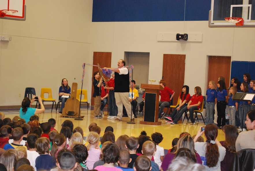 Marvin Peevey, Sheppard Air Force Base Elementary principal, assists two Sheppard AFB fourth-graders with cutting the ribbon at their new gymnasium's dedication ceremony March 25.  The Sheppard AFB Elementary Gymnasium is the largest addition since the school was erected in 1953. The new gym was funded by the 2006 bond election money from WFISD. (U.S. Air Force photo/Tech. Sgt. Vernon Cunningham)