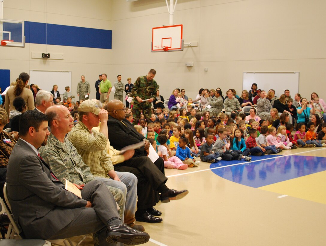 Parents, students, faculty and special guests attend the Sheppard Air Force Base Elementary Gymnasium dedication March 25.  From left to right, special guests  included Dr. George Kazanas (front left), Wichita Falls Independent School District  superintendent; Col. Michael Hake, 82nd Training Wing vice commander;  Chad Bishop, construction contractor; Ken Hines, WFISD board member; and Reginald Blow, WFISD vice president. The new gym was dedicated to all past, present and future students of Sheppard AFB Elementary School (U.S. Air Force photo/Tech. Sgt. Vernon Cunningham)