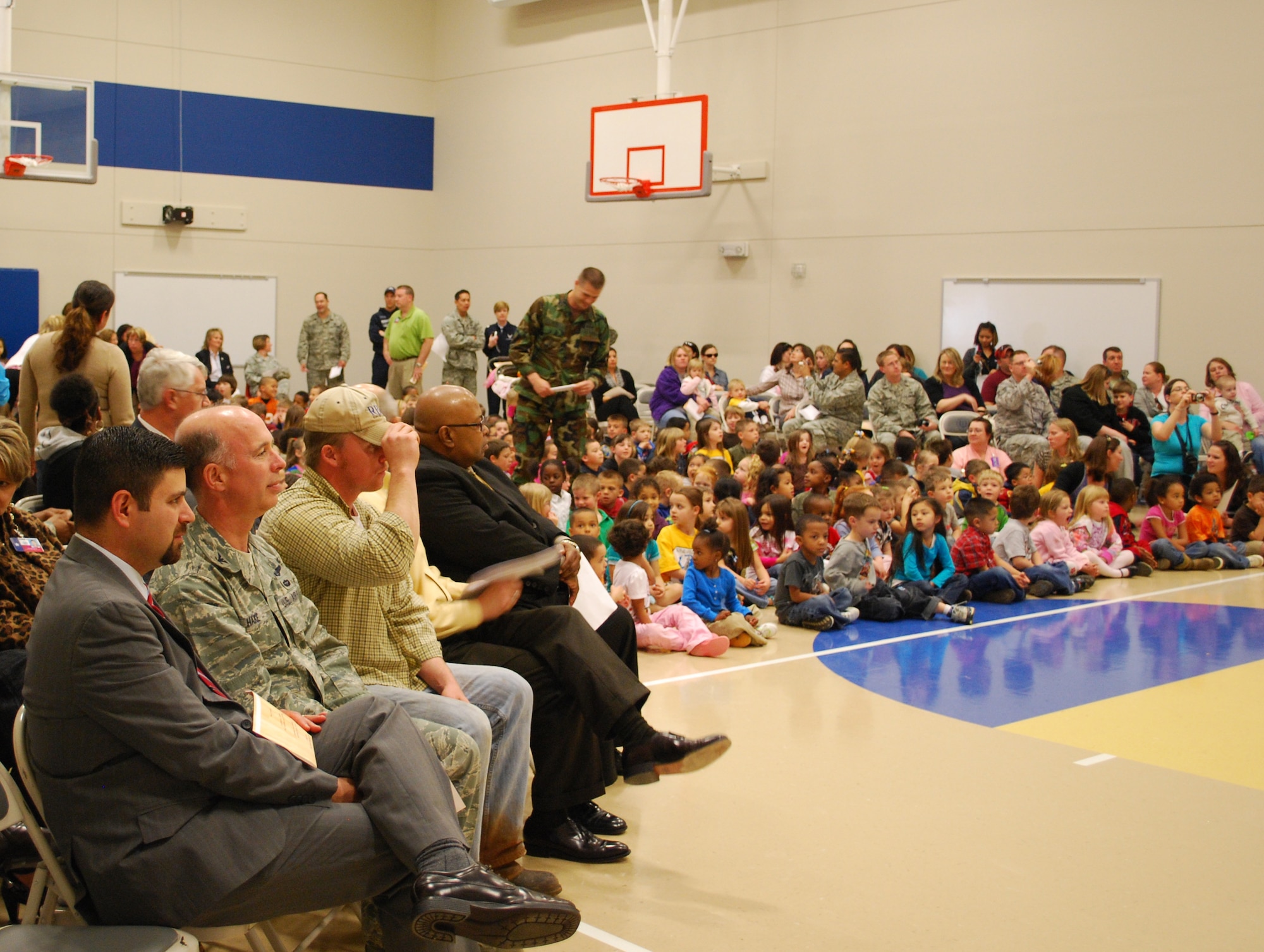 Parents, students, faculty and special guests attend the Sheppard Air Force Base Elementary Gymnasium dedication March 25.  From left to right, special guests  included Dr. George Kazanas (front left), Wichita Falls Independent School District  superintendent; Col. Michael Hake, 82nd Training Wing vice commander;  Chad Bishop, construction contractor; Ken Hines, WFISD board member; and Reginald Blow, WFISD vice president. The new gym was dedicated to all past, present and future students of Sheppard AFB Elementary School (U.S. Air Force photo/Tech. Sgt. Vernon Cunningham)