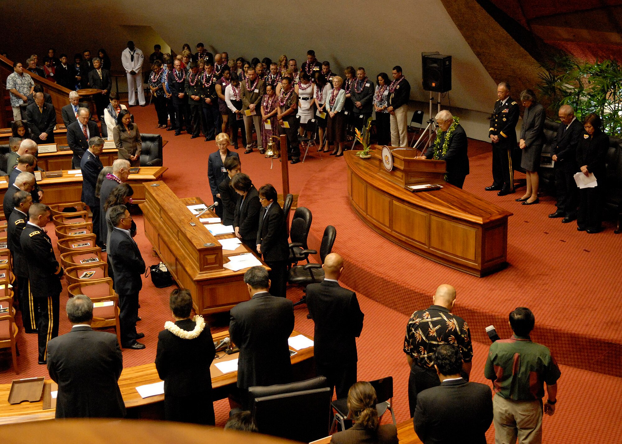 Reverend William H. Kaina, prays at a special ceremony with family members, friends and coworkers of 28 service members, who were posthumously presented the Hawaii Medal of Honor at the State Capitol, Honolulu, Hawaii, March 23, 2010. United States Air Force, Pacific Air Forces, First Lieutenant Roslyn L. Schulte was among the service members who received the prestigious medal. The Hawaii Medal of Honor was created in 2005 to recognize the heroism of those members of the U.S. armed forces with links to Hawaii who are killed in action while serving our country as part of Operation Iraqi Freedom and Operation Enduring Freedom in Iraq and Afghanistan. The presentation of the Hawaii Medal of Honor was the first of its kind in the nation, and has become the model for similar ceremonies in other states. (U.S. Air Force photo/Tech. Sgt. Jerome S. Tayborn)

