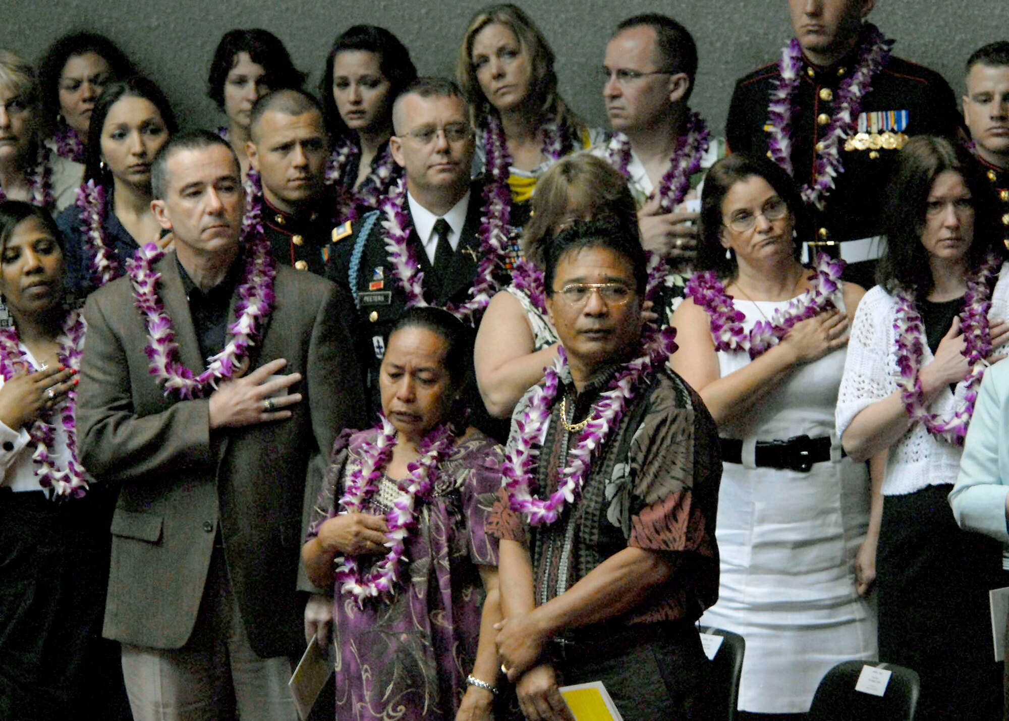 Family members, friends, and coworkers stand during the singing of the National Anthem and Hawaii Pono?I, at a special ceremony honoring 28 fallen service members being presented the Hawaii Medal of Honor, at the State Capitol, Hawaii. The Hawaii Medal of Honor was created in 2005 to recognize the heroism of those members of the U.S. armed forces with links to Hawaii who are killed in action while serving our country as part of Operation Iraqi Freedom and Operation Enduring Freedom in Iraq and Afghanistan. The presentation of the Hawaii Medal of Honor was the first of its kind in the nation, and has become the model for similar ceremonies in other states. (U.S. Air Force photo/Tech. Sgt. Jerome S. Tayborn)