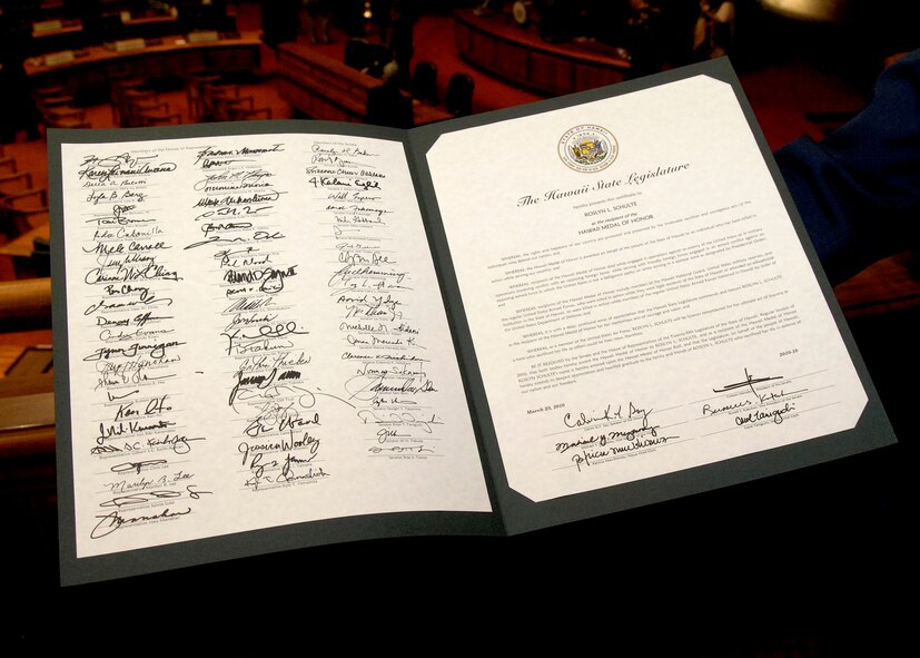 U. S. Air Force 1st Lt. Roslyn L. Schulte?s citation was presented posthumously to her supervisor Lt. Col. Christopher Sartorius from the 613th Air and Space Operations Center, by the Hawaii Legislature, at the State Capitol, Hawaii, March 23, 2010. Lt. Col. Sartorius accepted the medal and citation on behalf of 1st Lt. Schulte and her family.  She was among 28 fallen service members being awarded the Hawaii Medal of Honor during a special ceremony. The Hawaii Medal of Honor was created in 2005 to recognize the heroism of those members of the U.S. armed forces with links to Hawaii who are killed in action while serving our country as part of Operation Iraqi Freedom and Operation Enduring Freedom in Iraq and Afghanistan. The presentation of the Hawaii Medal of Honor was the first of its kind in the nation, and has become the model for similar ceremonies in other states. (U.S. Air Force photo/Tech. Sgt. Jerome S. Tayborn)