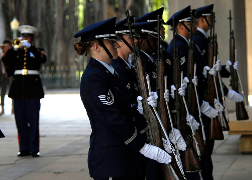 Members of Joint Base Hickam Pearl Harbor?s honor guard perform a 21-Gun Salute during the playing of Taps, to honor 28 fallen service members being presented the Hawaii Medal of Honor posthumously, during a special ceremony at the State Capitol, Honolulu, Hawaii, March 23, 2010.  The Hawaii Medal of Honor was created in 2005 to recognize the heroism of those members of the U.S. armed forces with links to Hawaii who are killed in action while serving our country as part of Operation Iraqi Freedom and Operation Enduring Freedom in Iraq and Afghanistan. The presentation of the Hawaii Medal of Honor was the first of its kind in the nation, and has become the model for similar ceremonies in other states. (U.S. Air Force photo/Tech. Sgt. Jerome S. Tayborn)